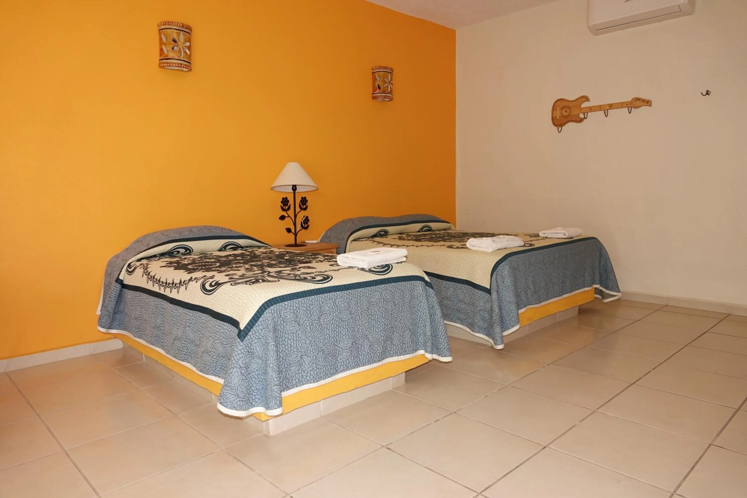 Bed in Quinta Comala Hotel & Villas