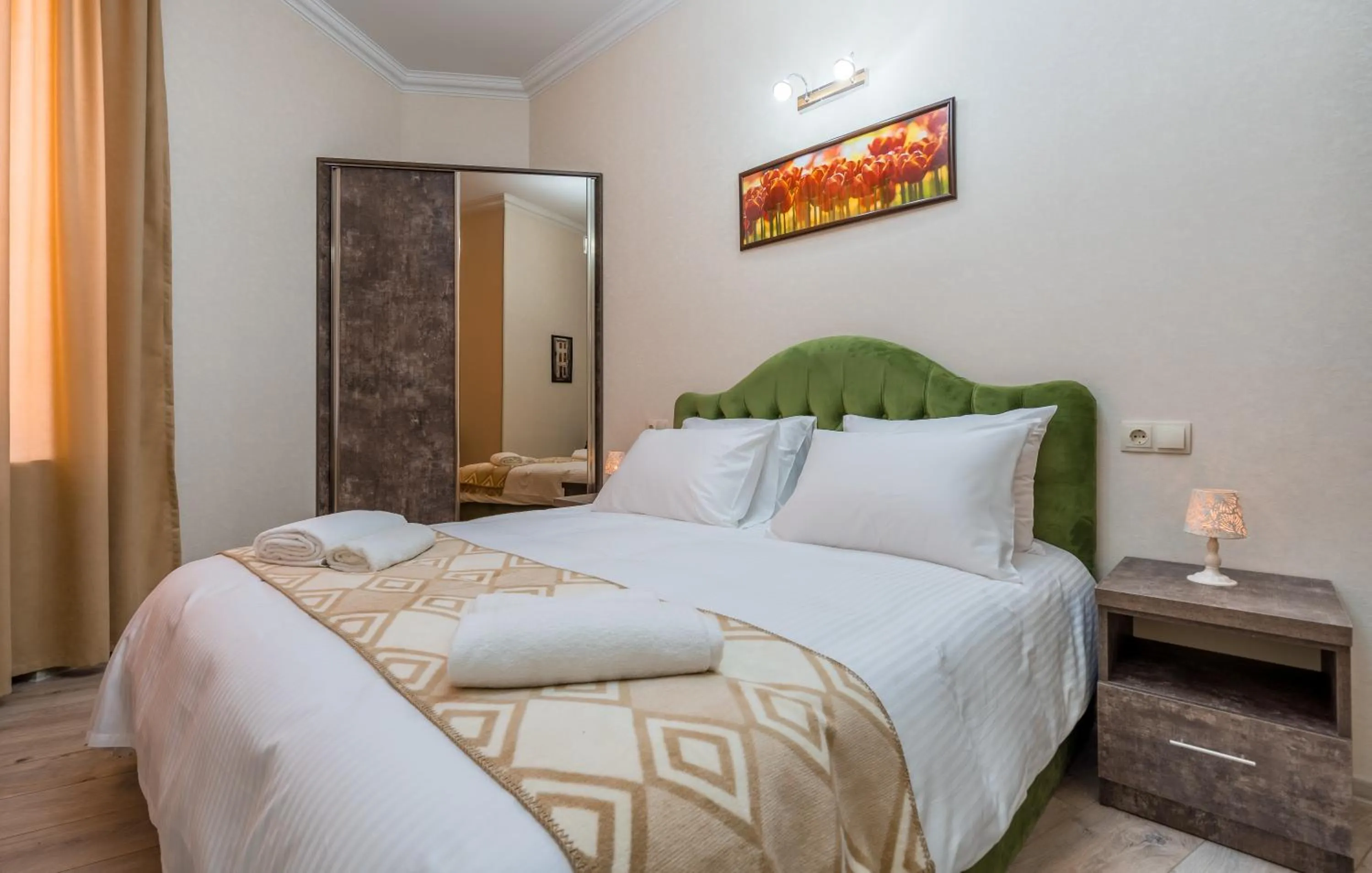 Bed in Golden Light Hotel