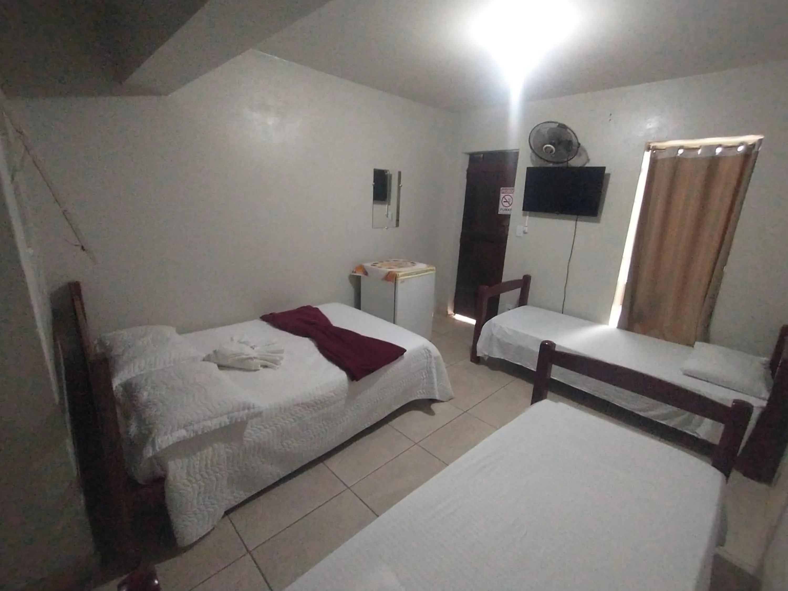 Bed in Pousada Acayaca