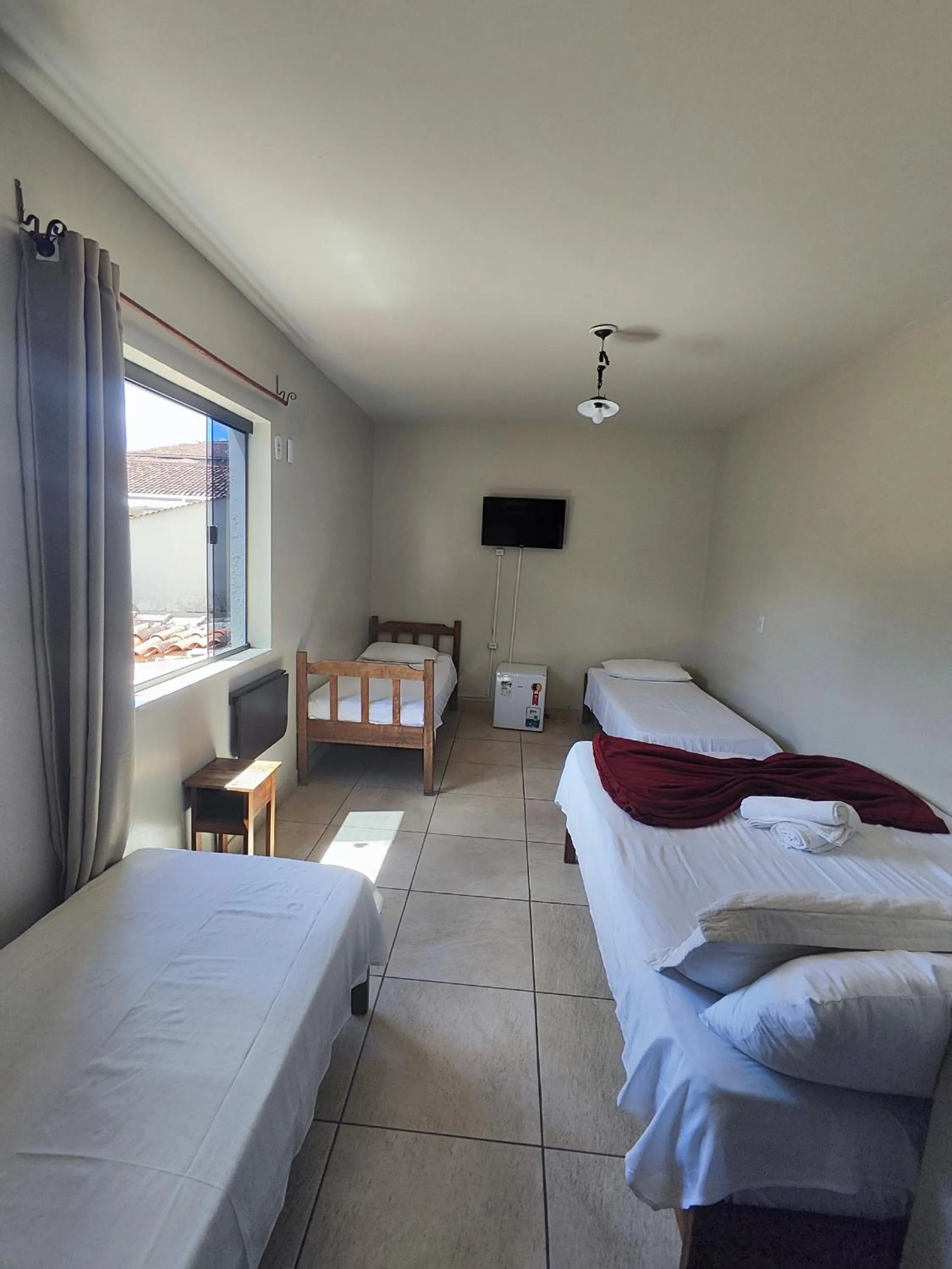 Bed in Pousada Acayaca