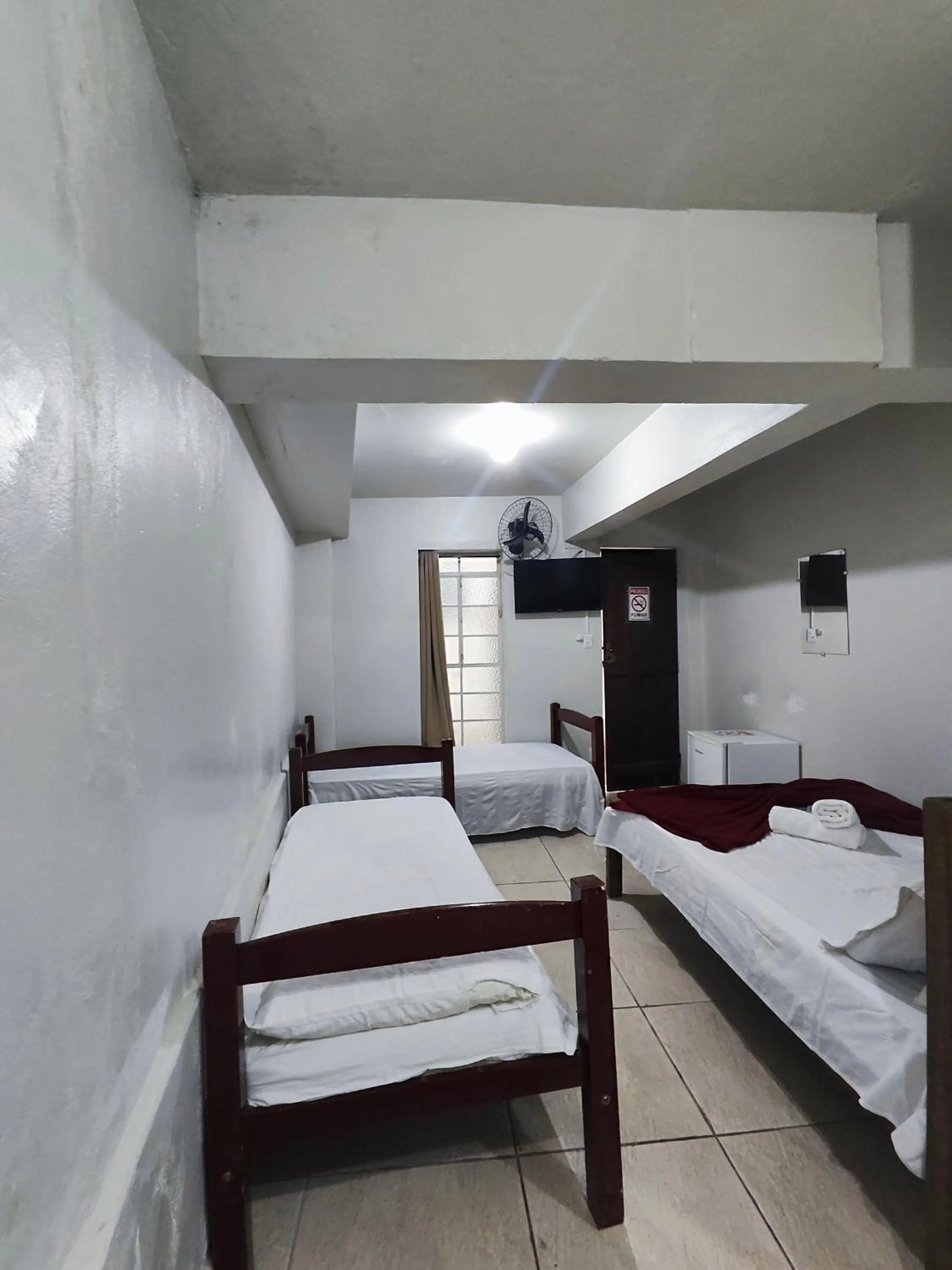 Bed in Pousada Acayaca