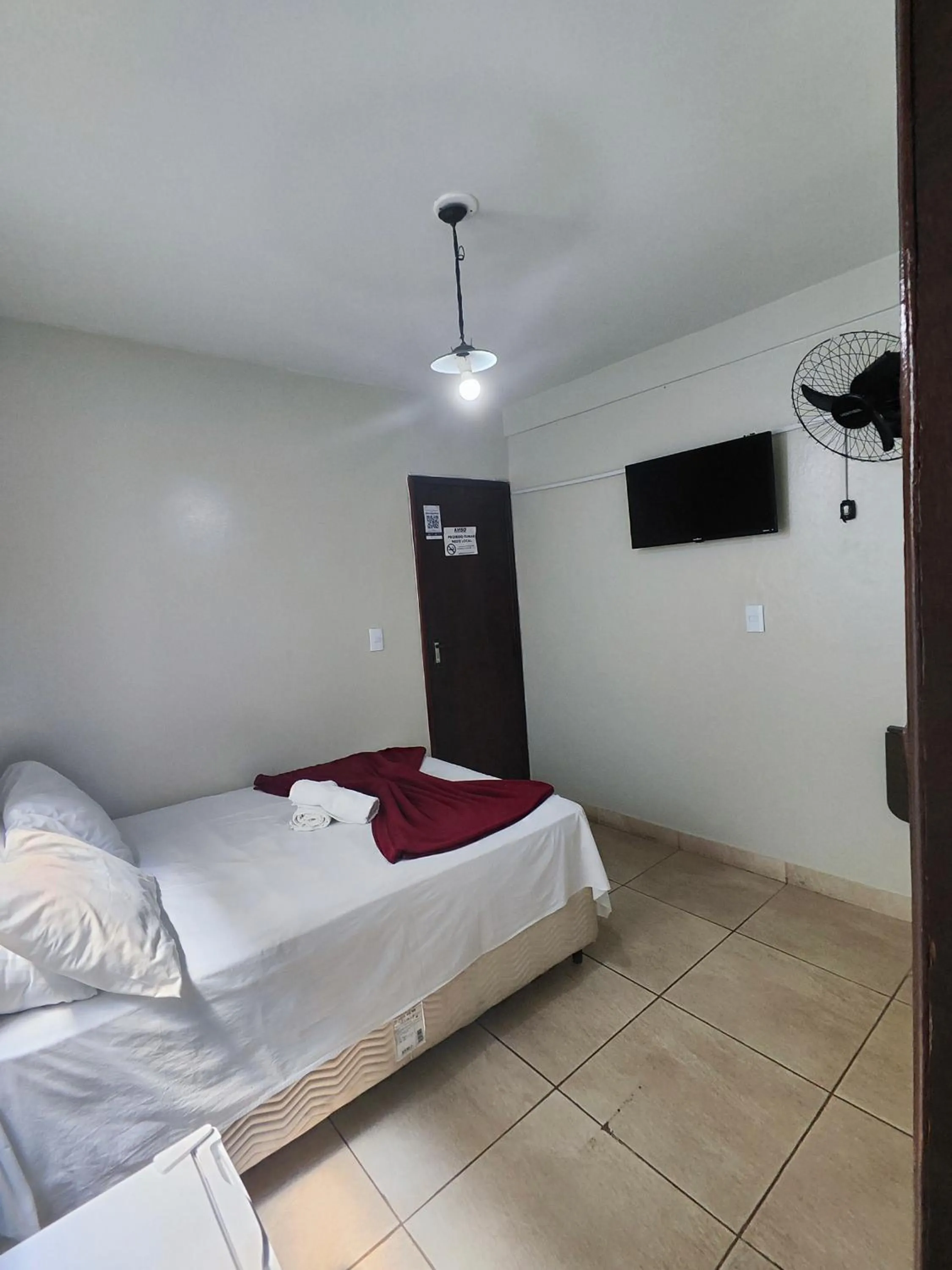 Bed in Pousada Acayaca