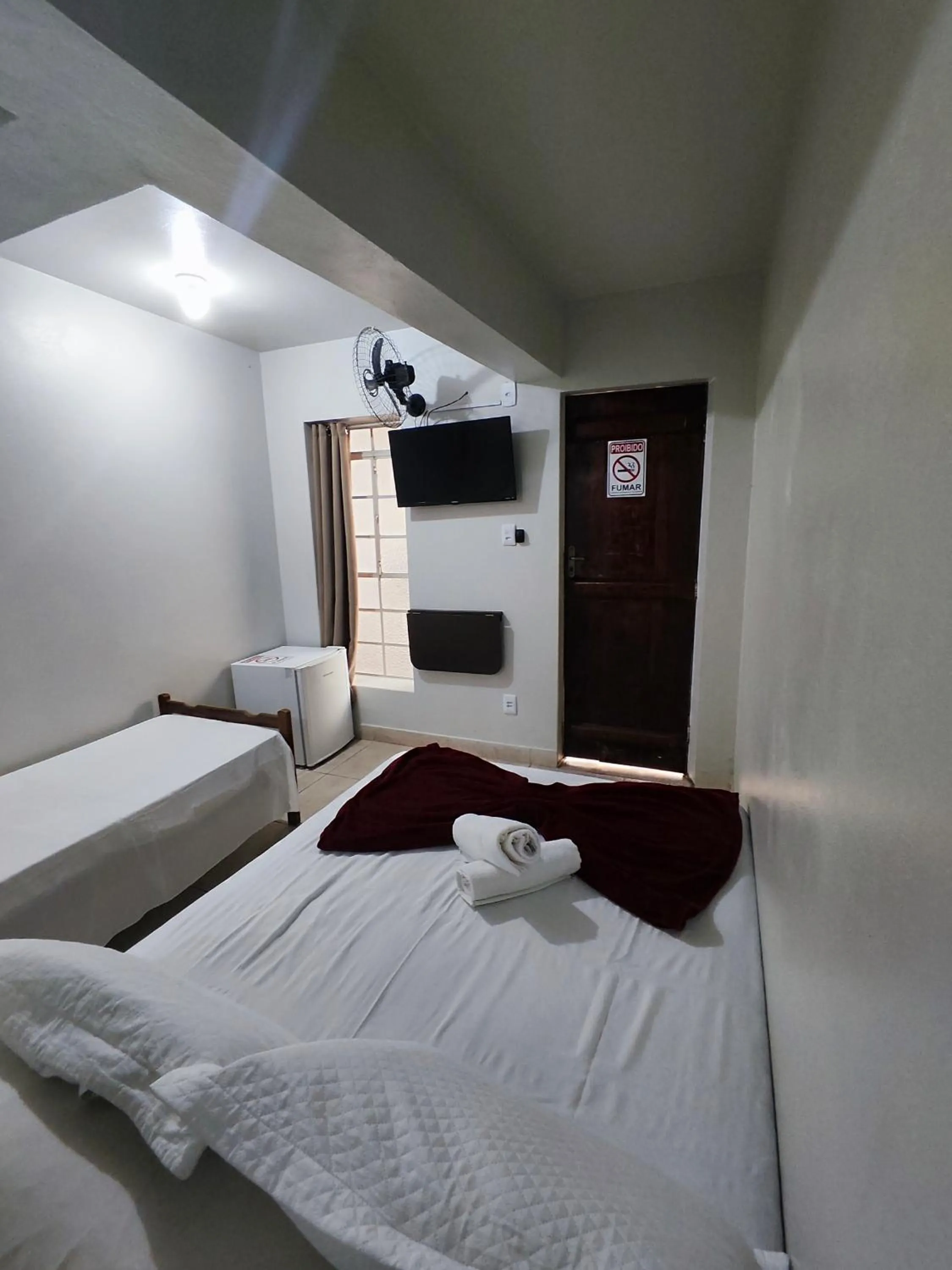 Bed in Pousada Acayaca