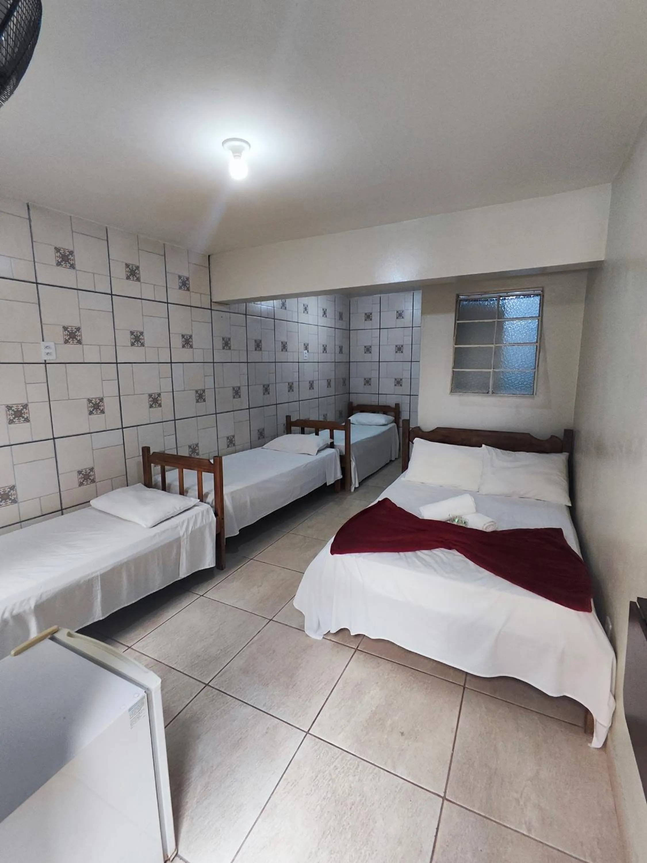 Bed in Pousada Acayaca