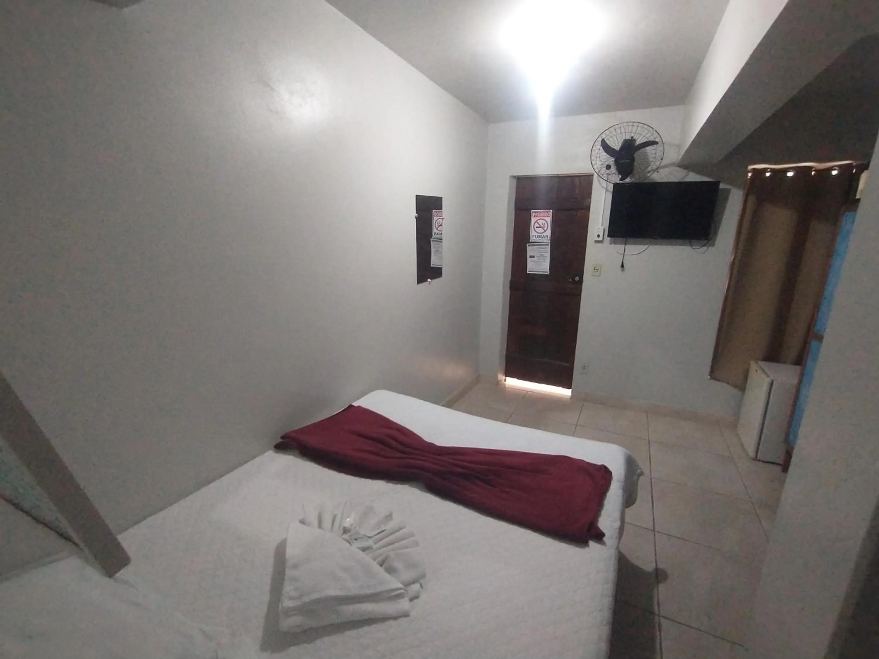 Bed in Pousada Acayaca