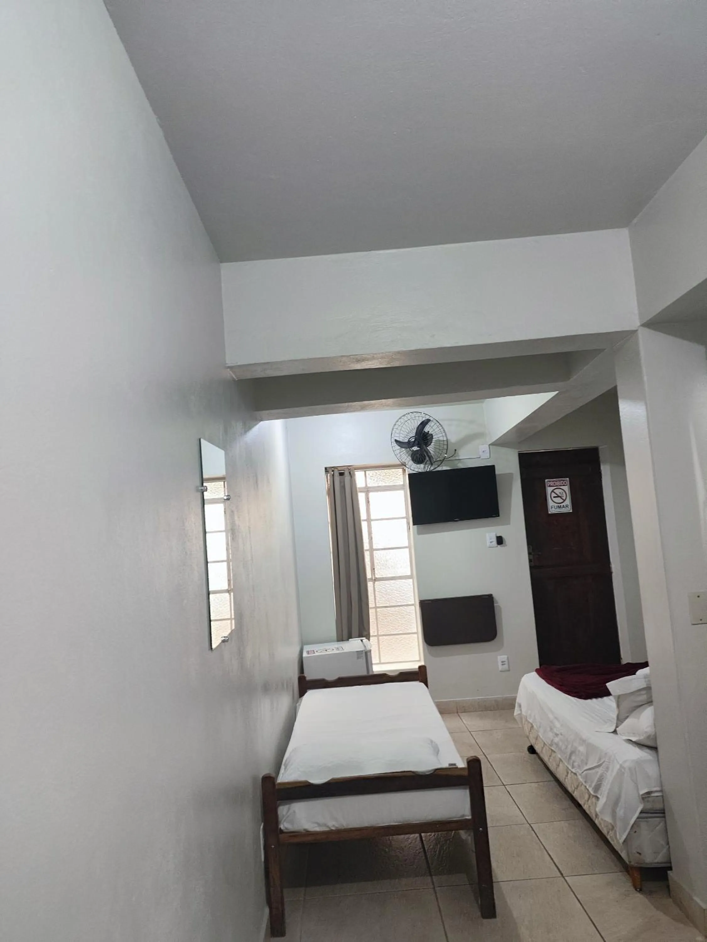 Bed in Pousada Acayaca