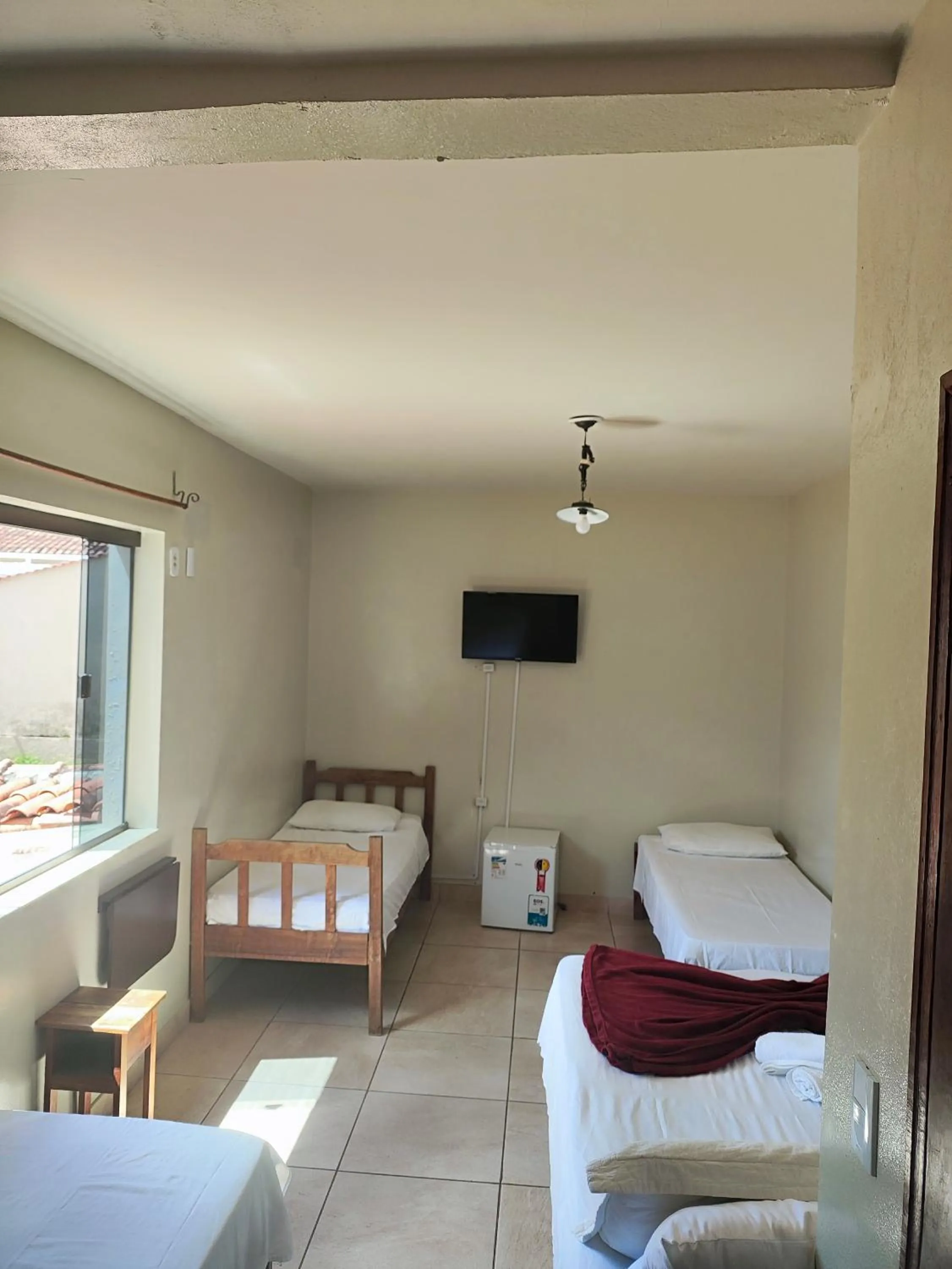 Bed in Pousada Acayaca