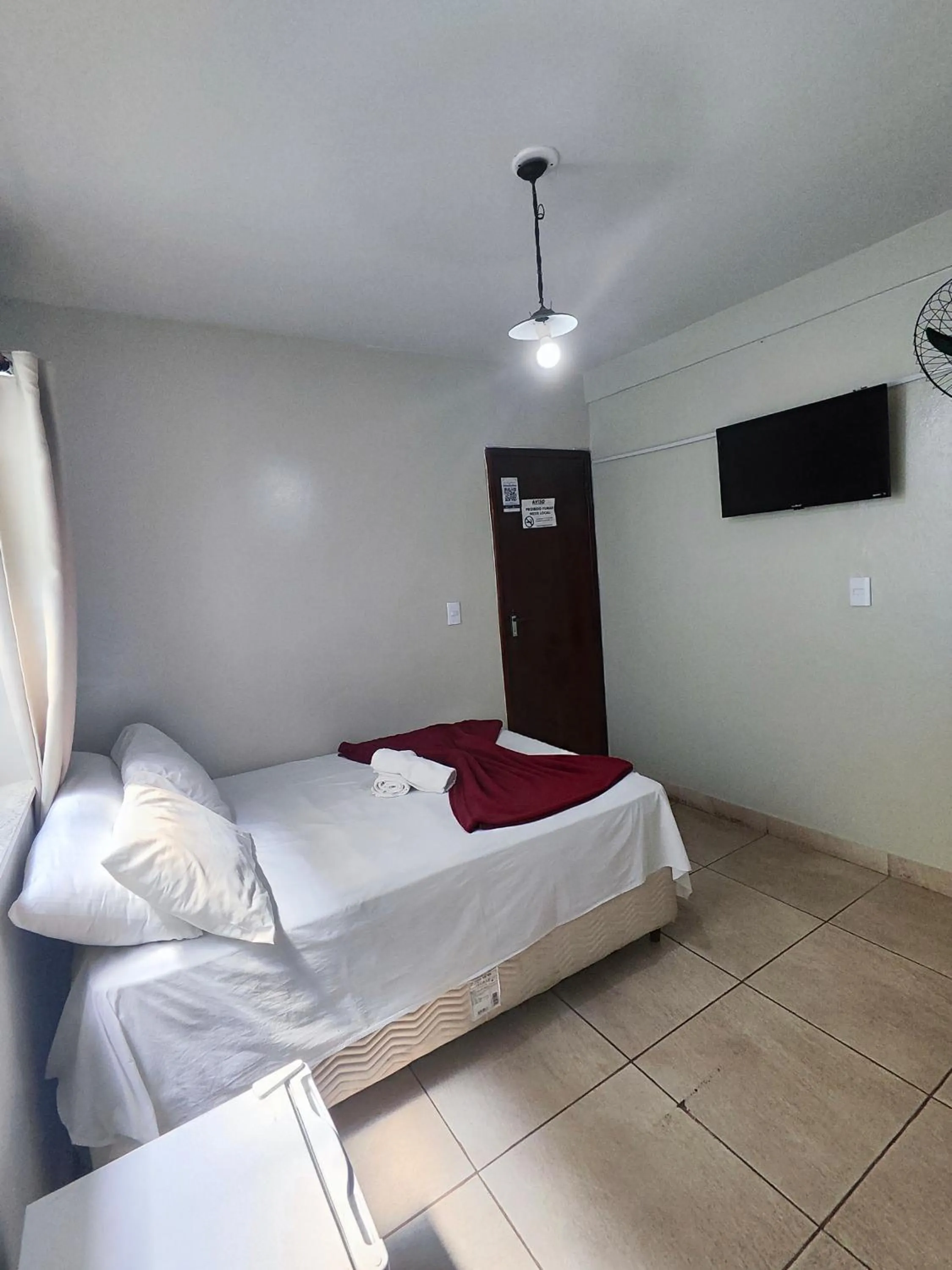 Bed in Pousada Acayaca