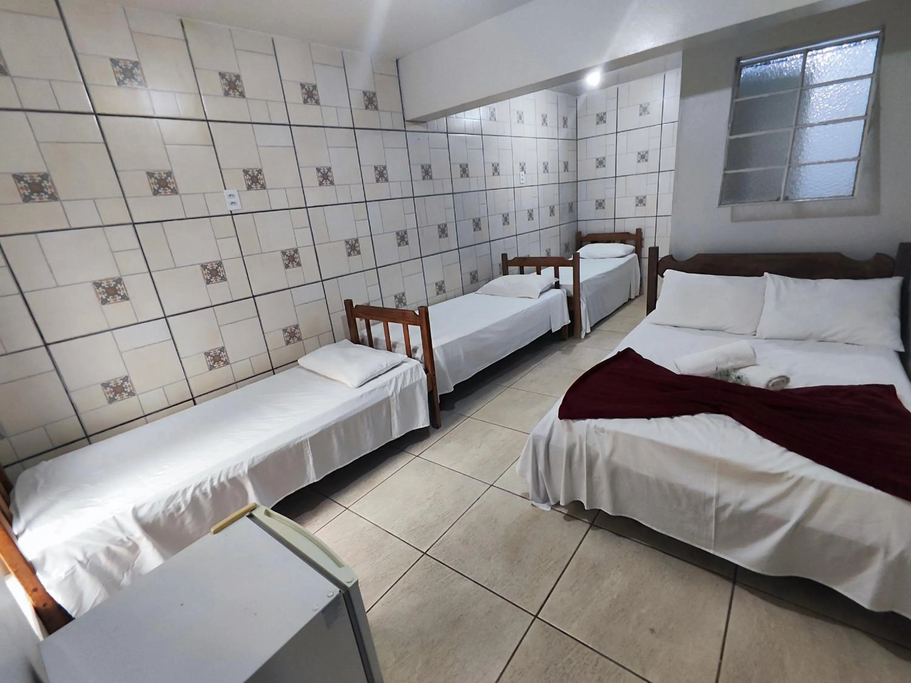 Bed in Pousada Acayaca