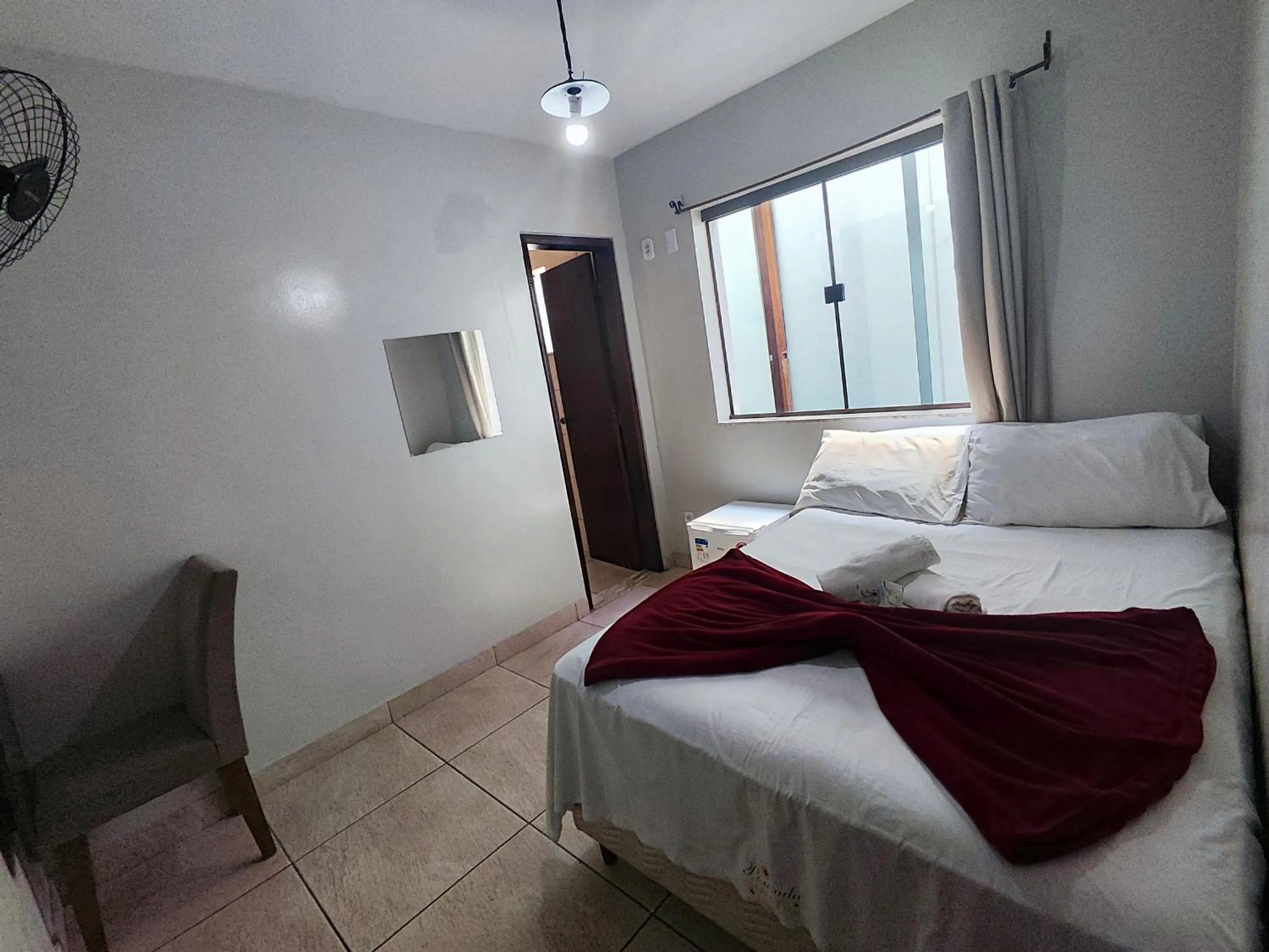 Bed in Pousada Acayaca