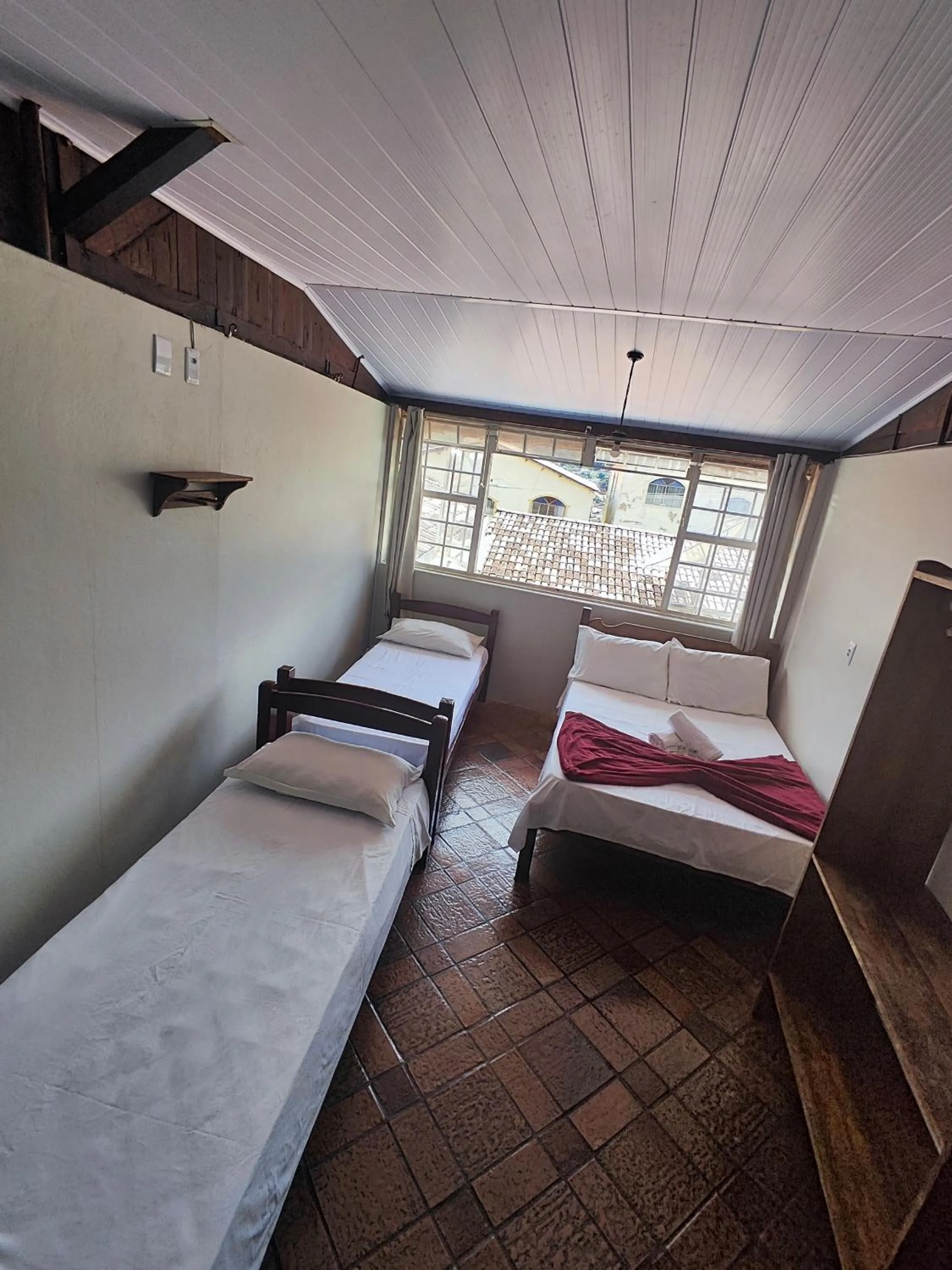 Bed in Pousada Acayaca