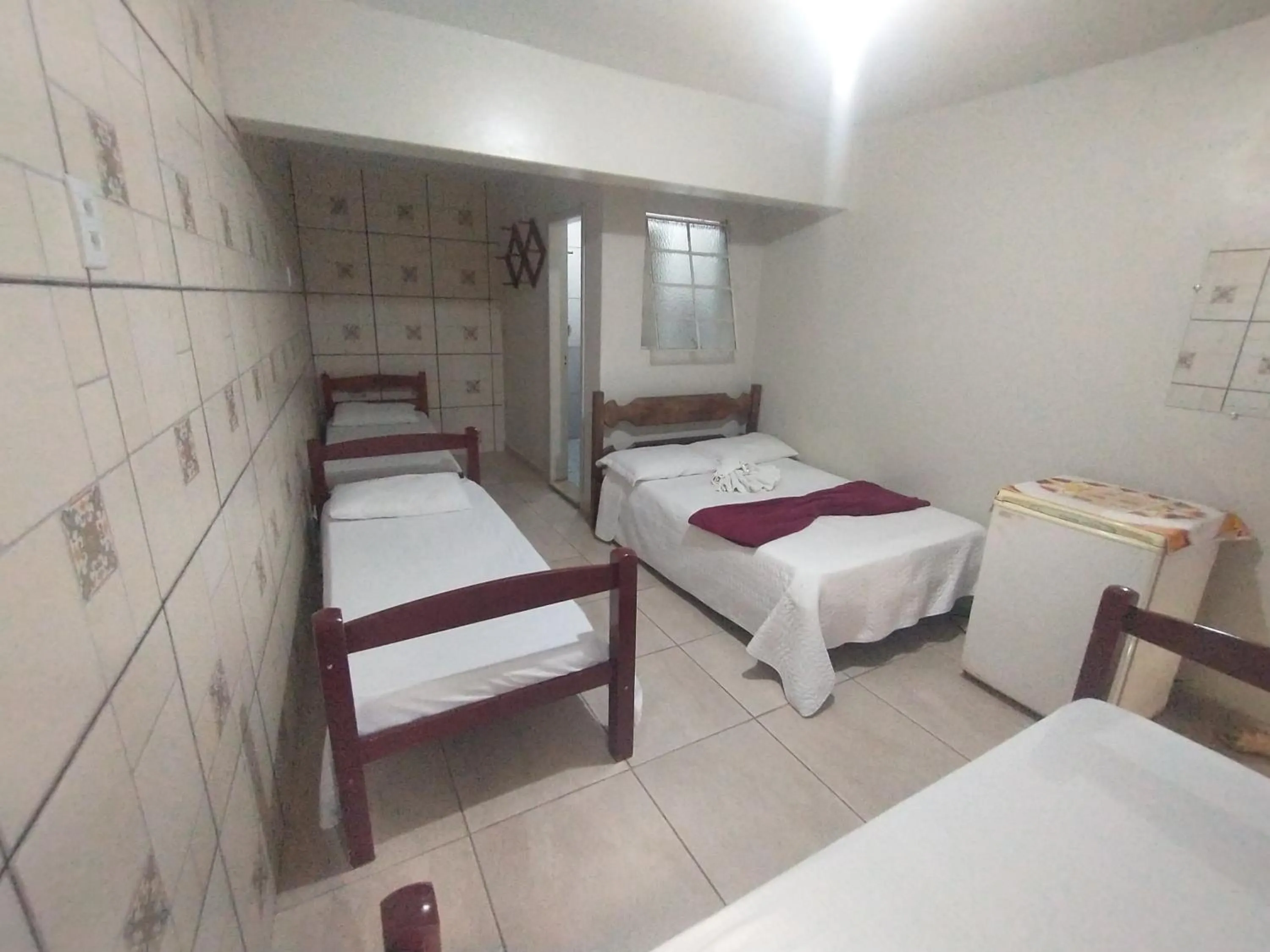 Bed in Pousada Acayaca