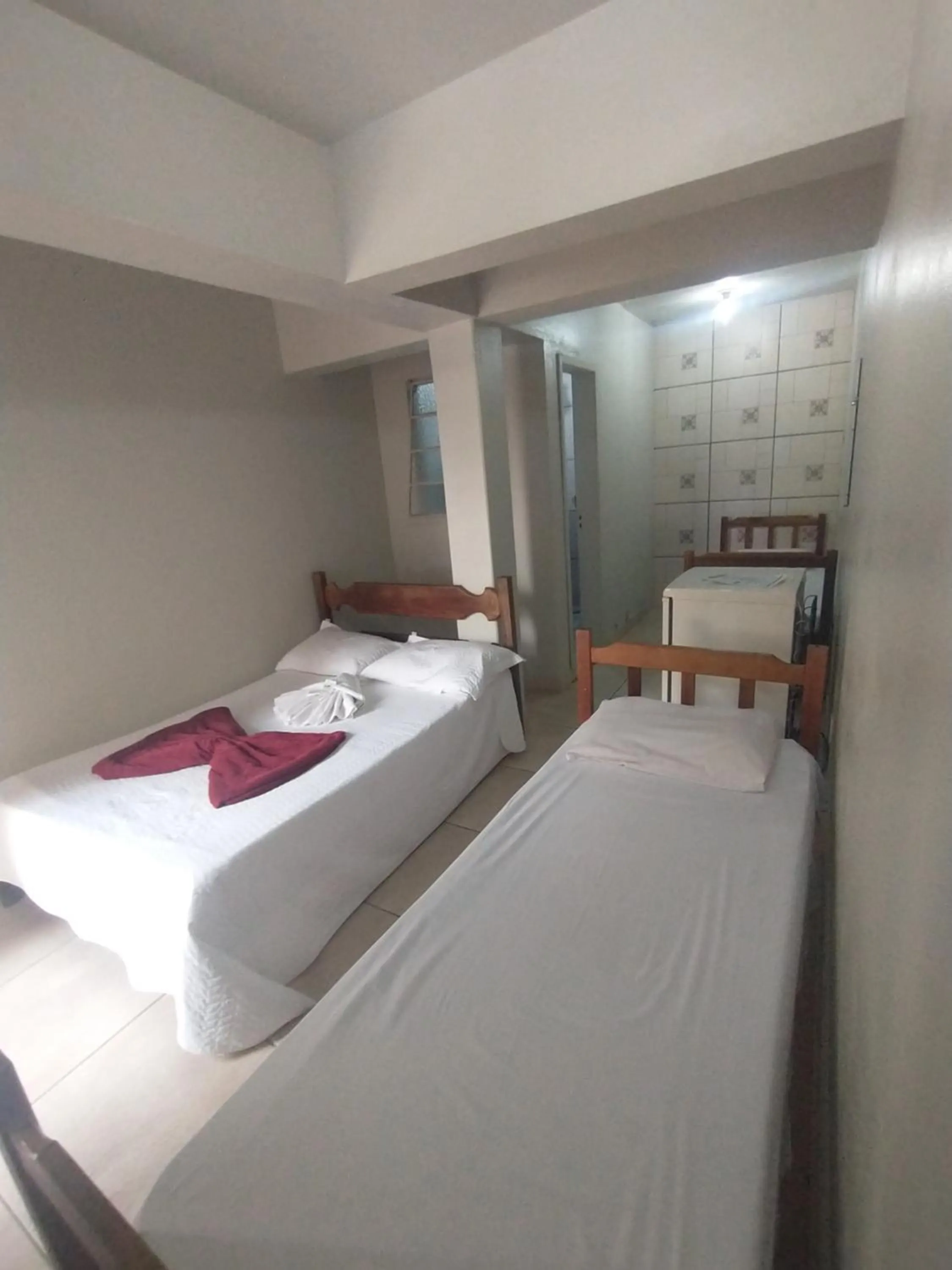 Bed in Pousada Acayaca