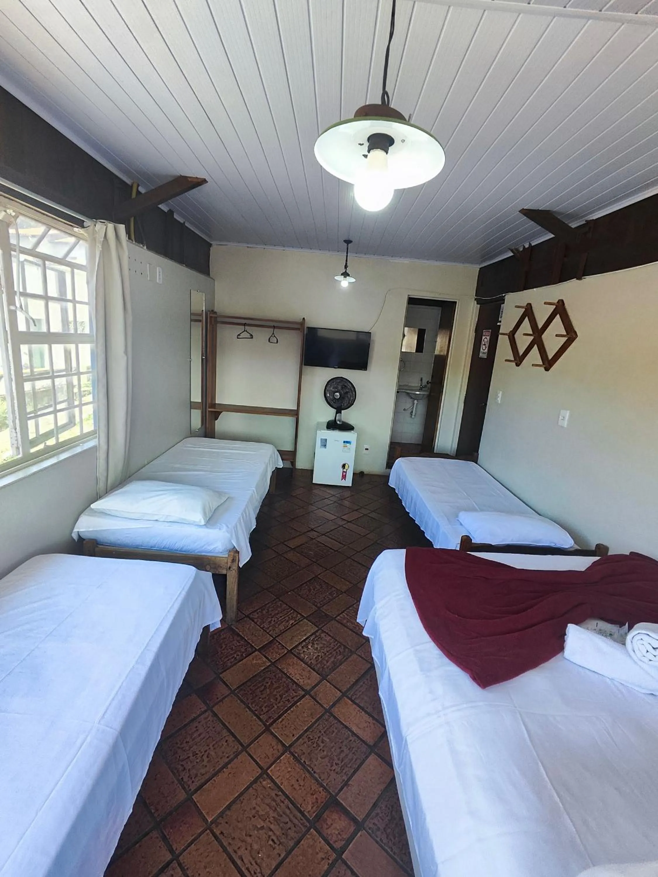 Bed in Pousada Acayaca