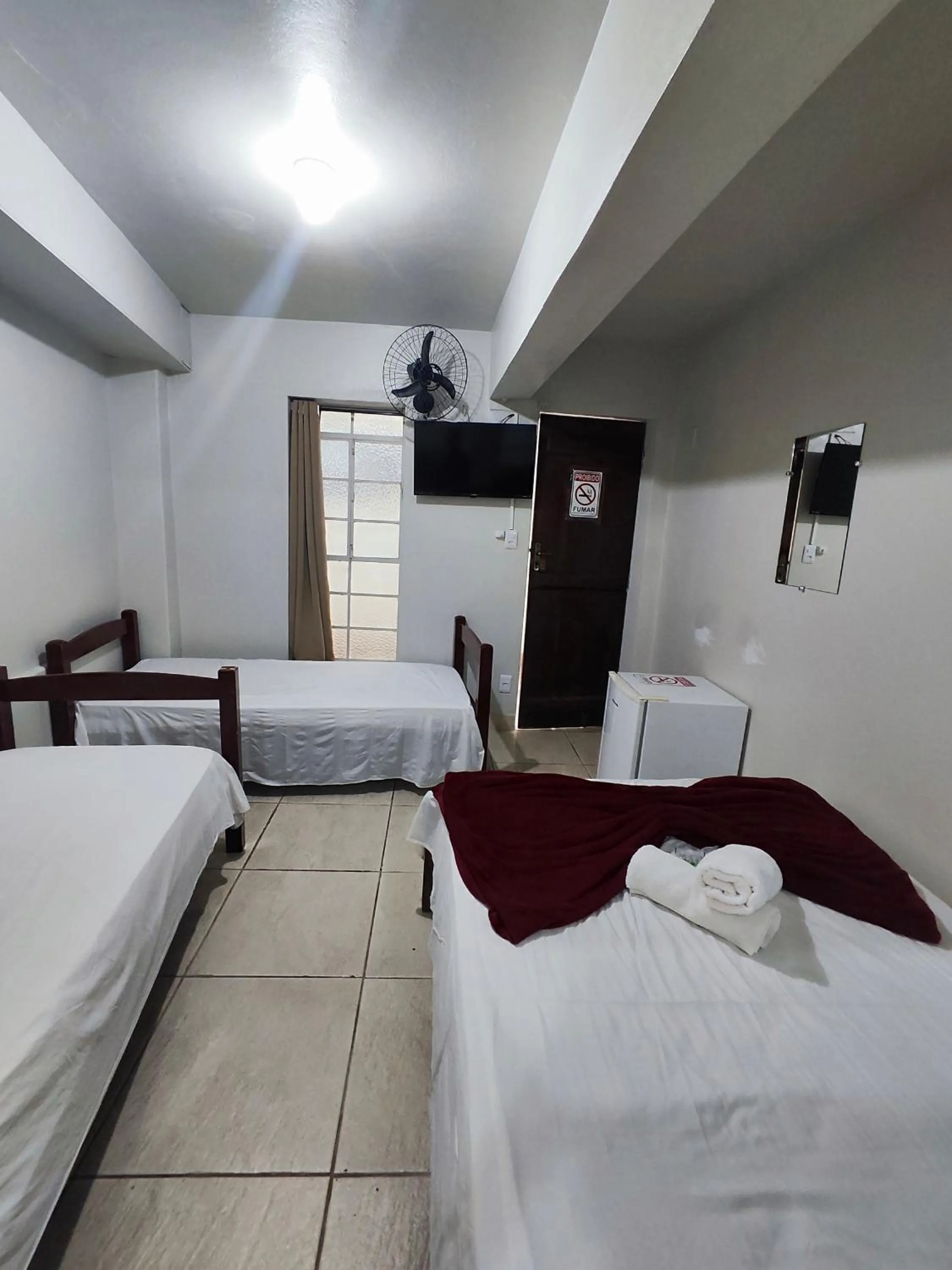 Bed in Pousada Acayaca