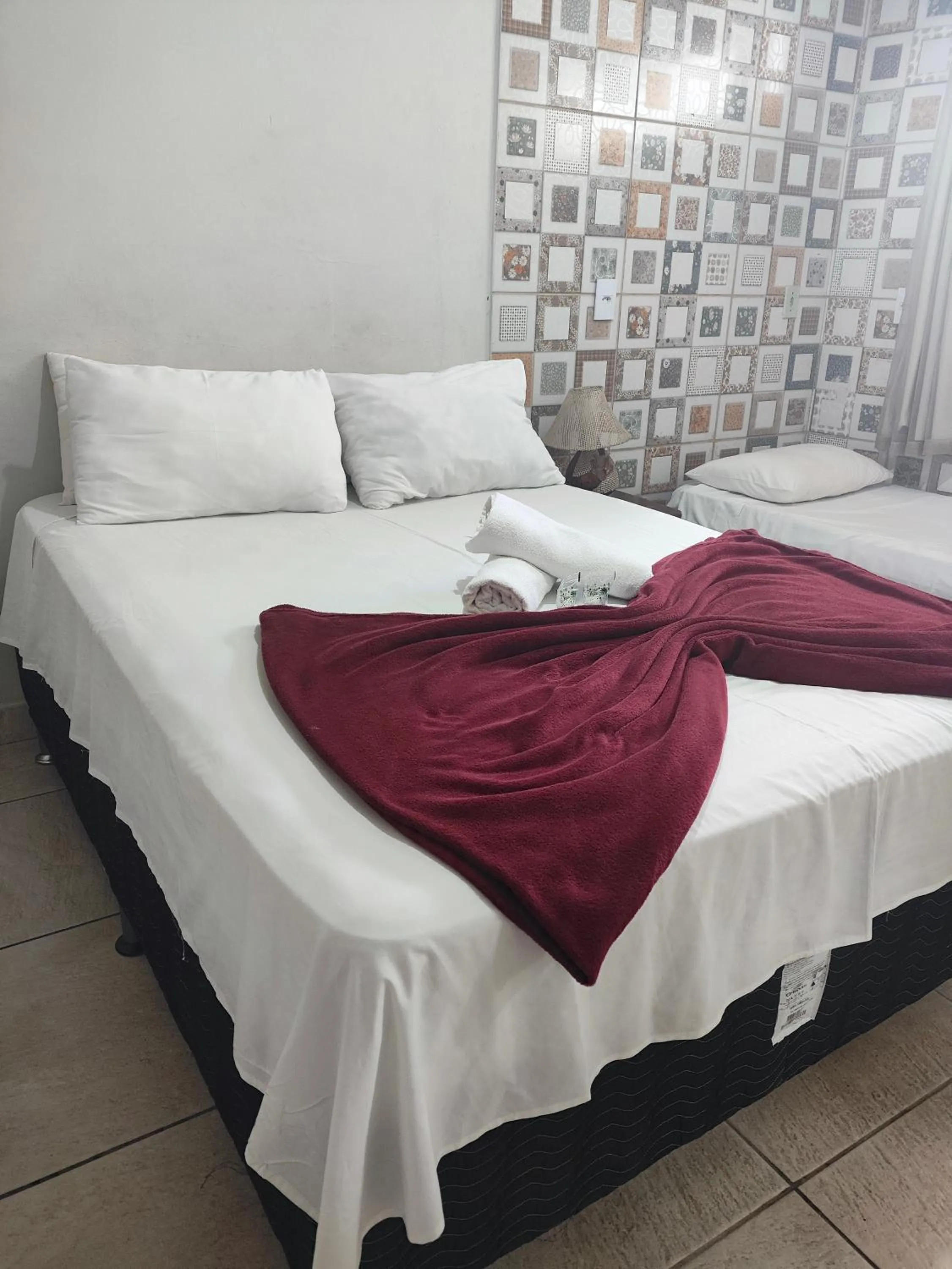 Bed in Pousada Acayaca