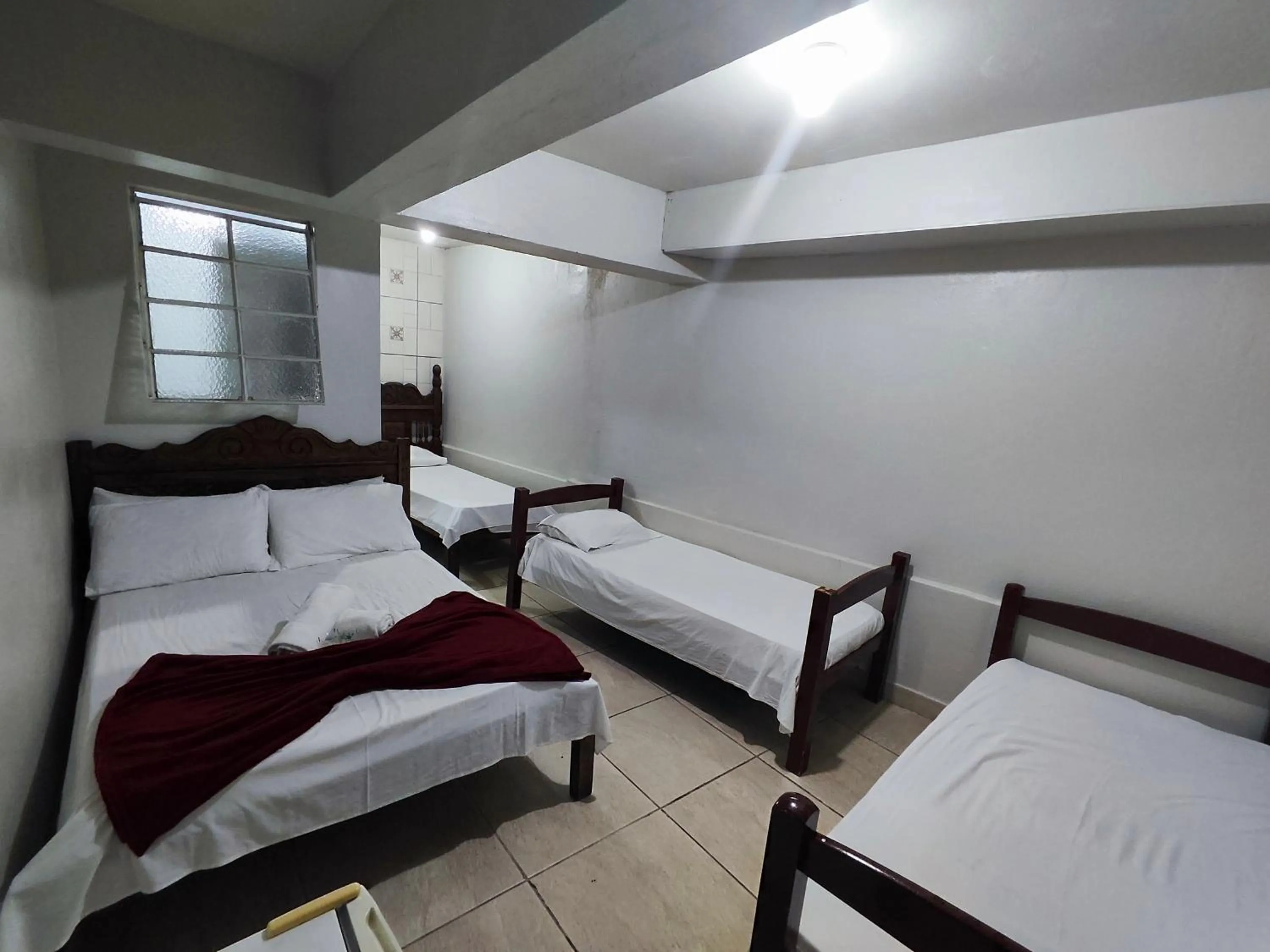 Bed in Pousada Acayaca