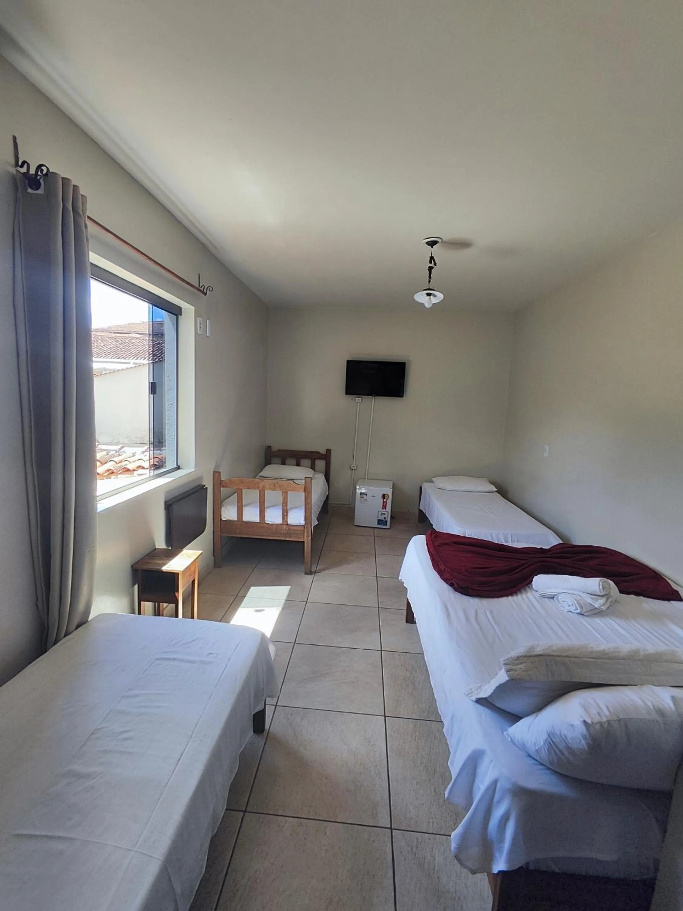 Bed in Pousada Acayaca