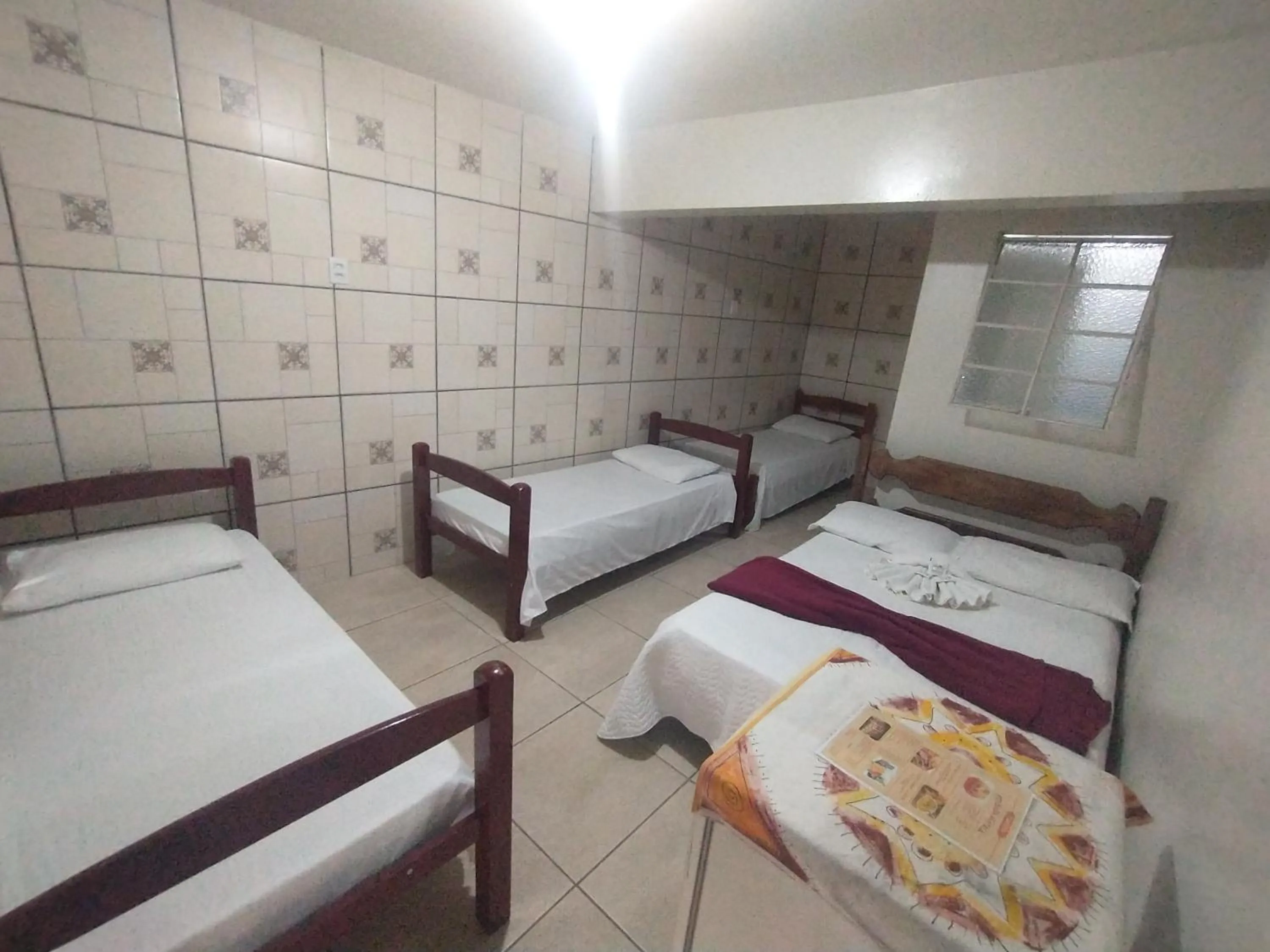 Bed in Pousada Acayaca