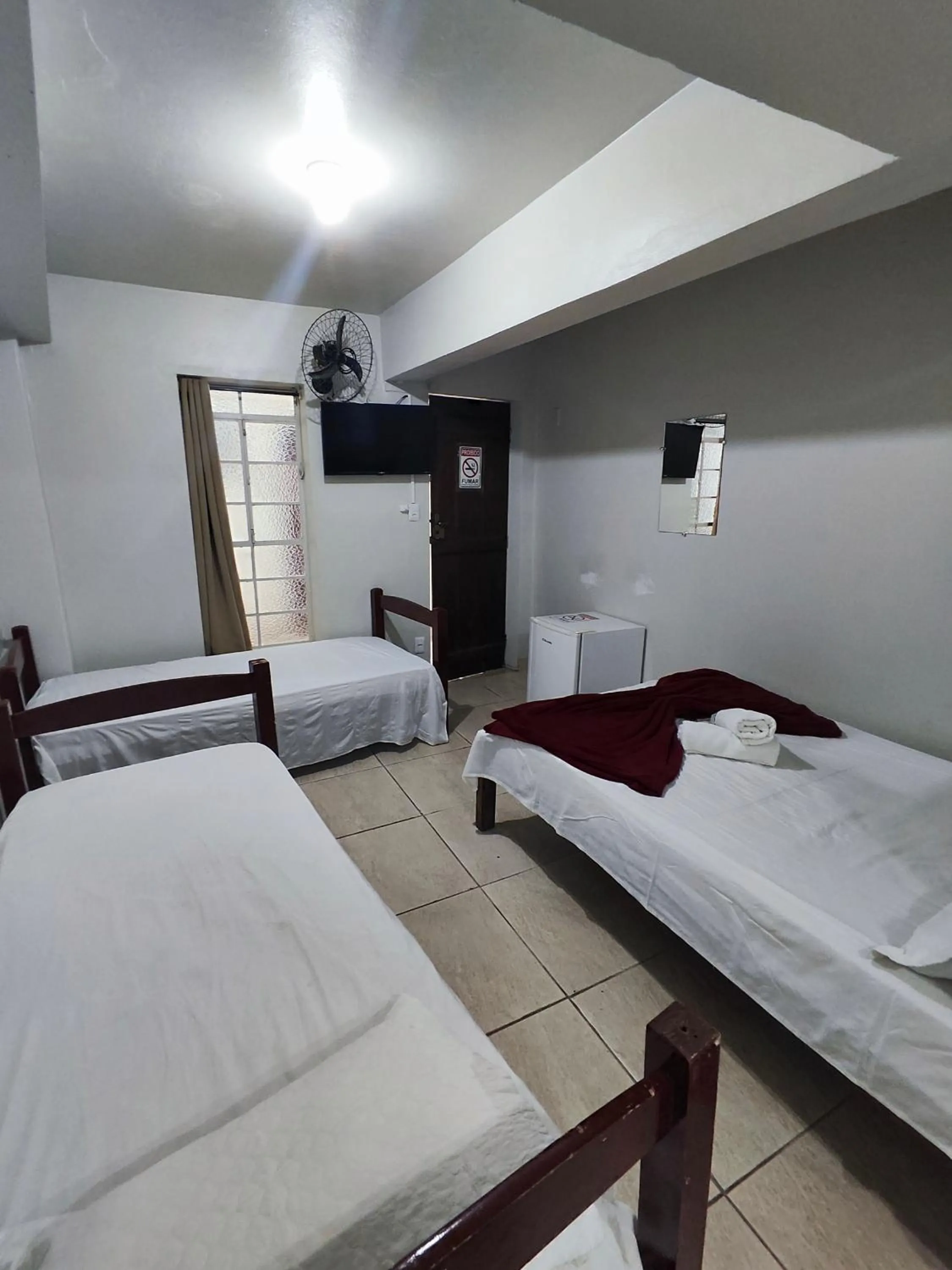 Bed in Pousada Acayaca