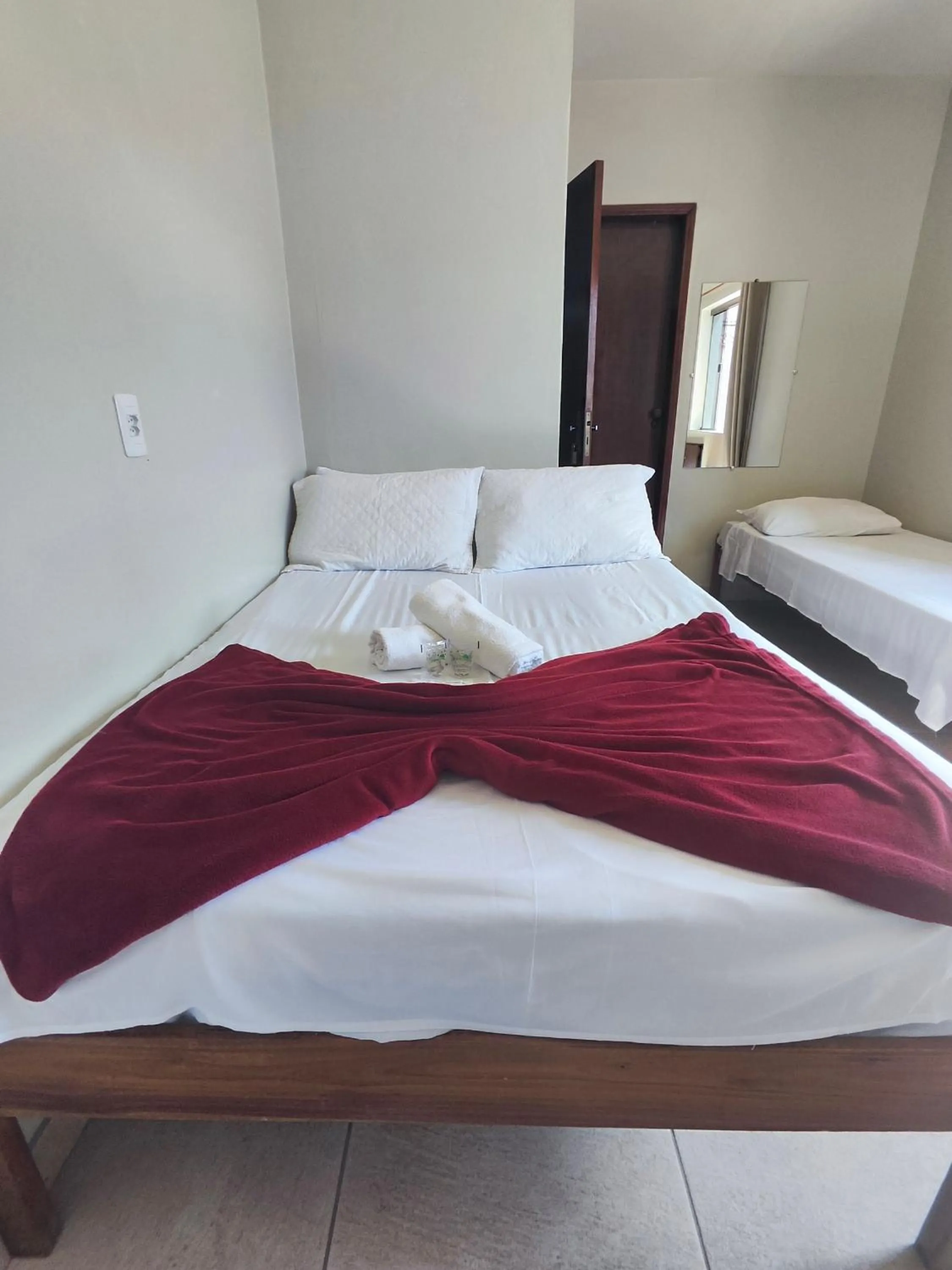 Bed in Pousada Acayaca