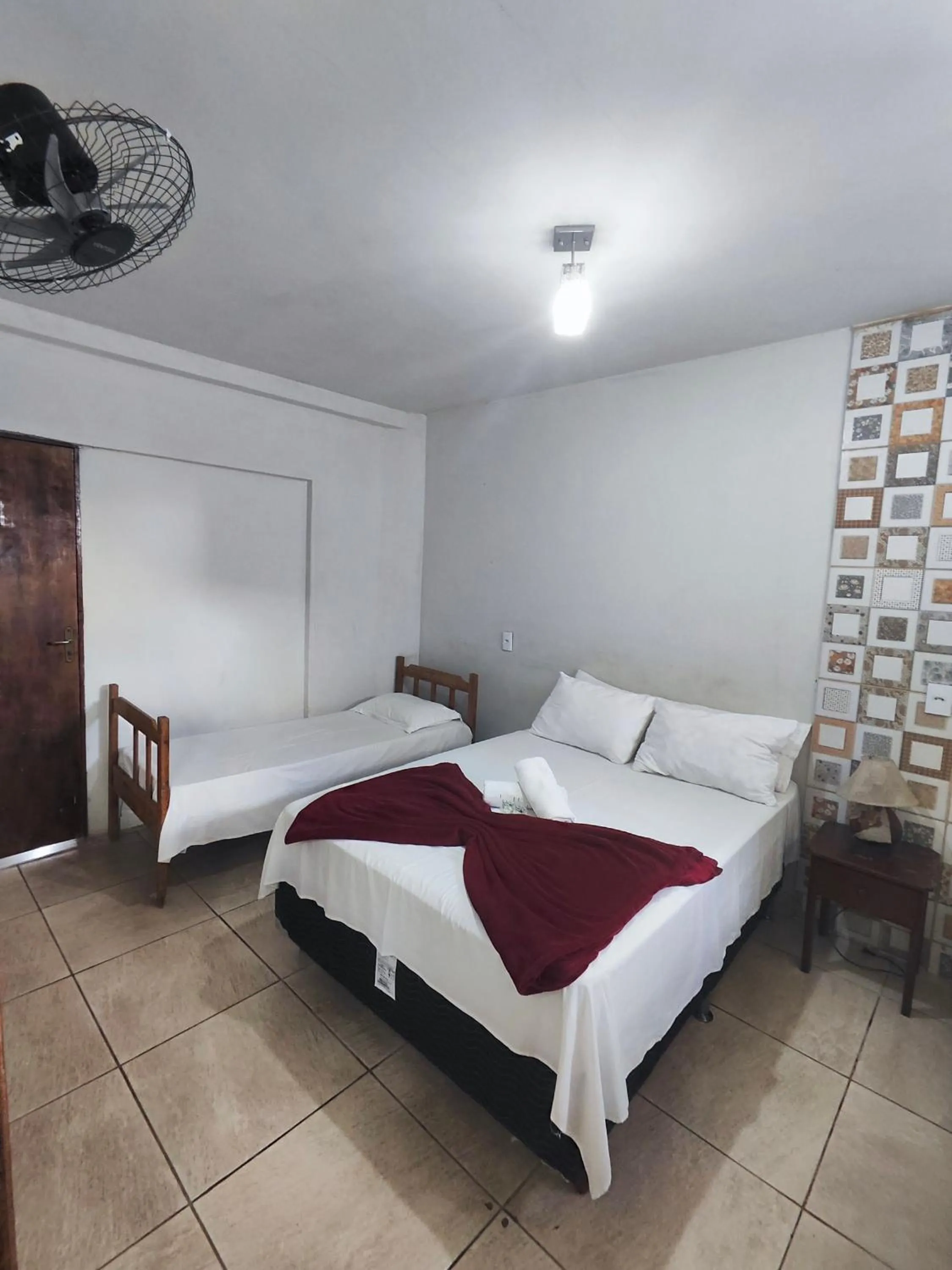 Bed in Pousada Acayaca