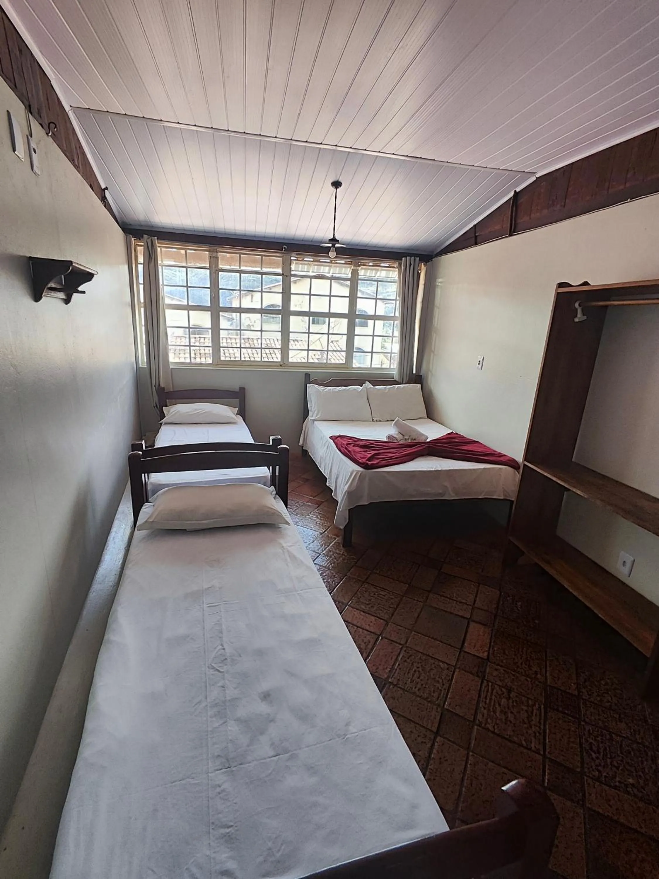 Bed in Pousada Acayaca