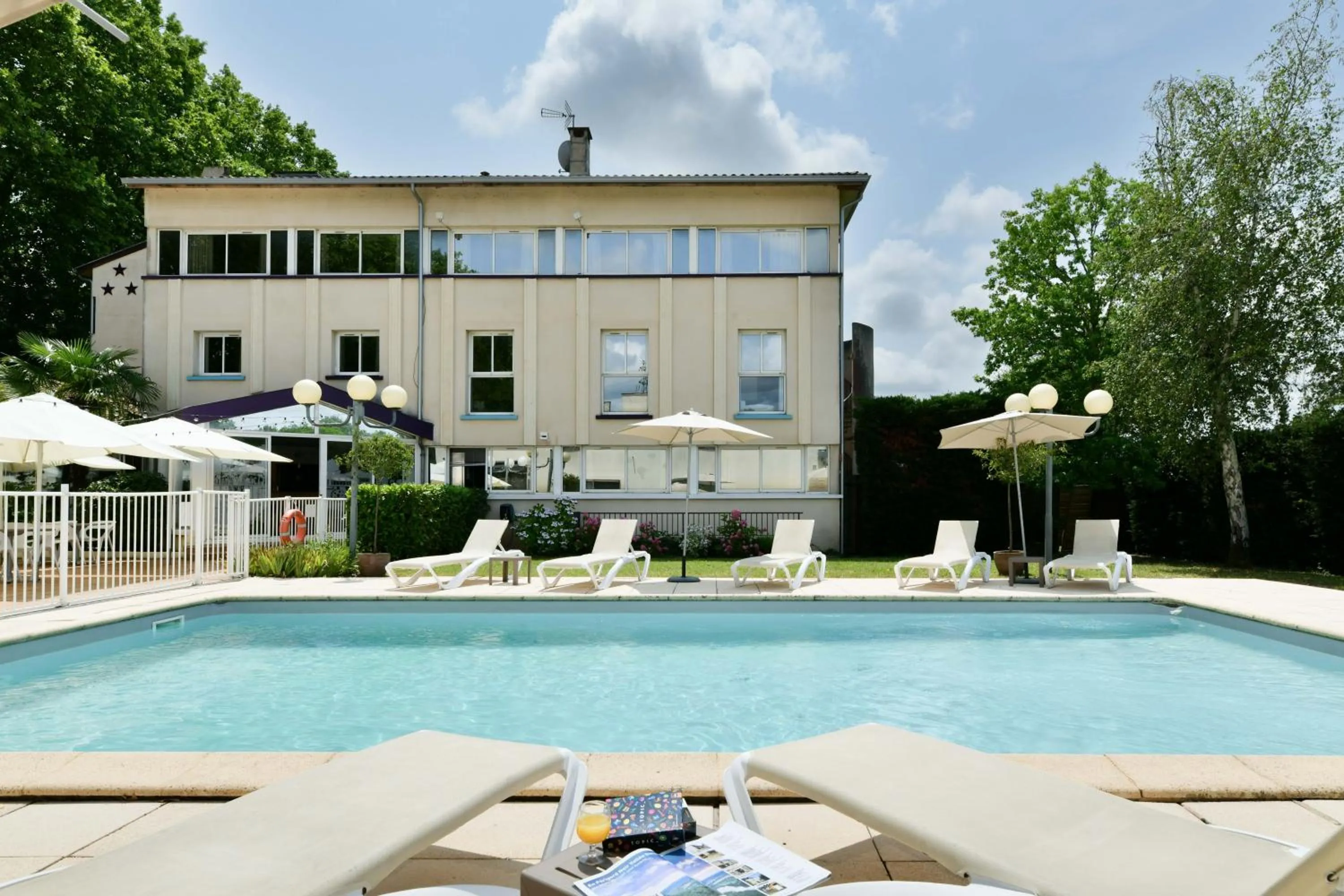Swimming pool in Logis Hôtel & Restaurant Ludik