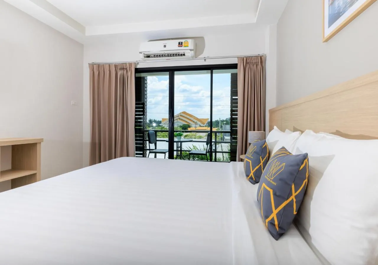 Bed in Baan Phor Phan Hotel