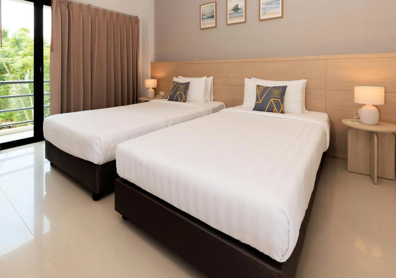 Bed in Baan Phor Phan Hotel