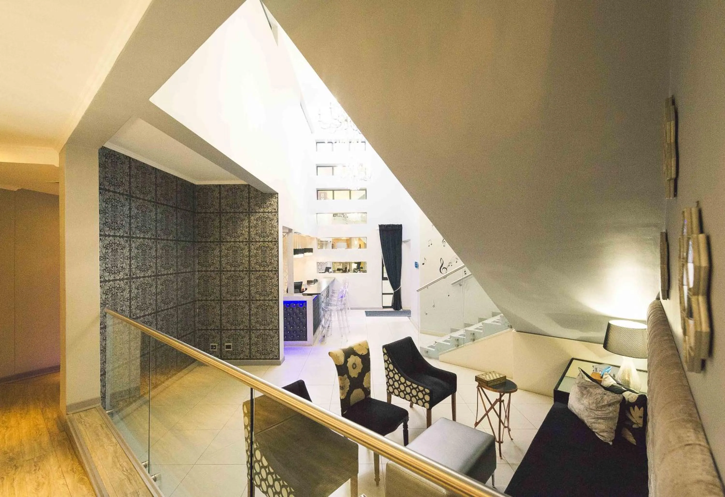 Communal lounge/ TV room in Blue Diamond Boutique Hotel