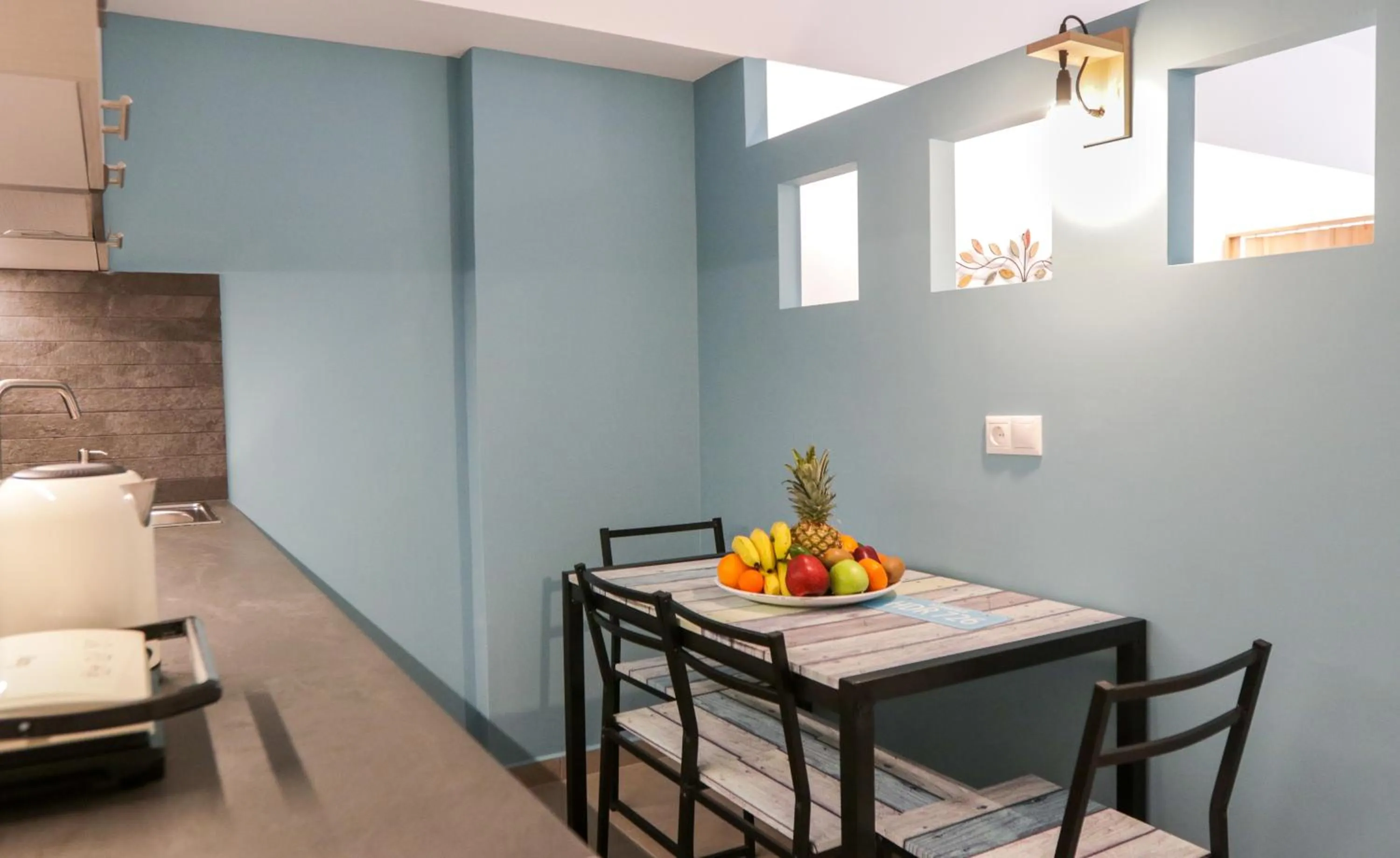 Kitchen or kitchenette in V36 Suites