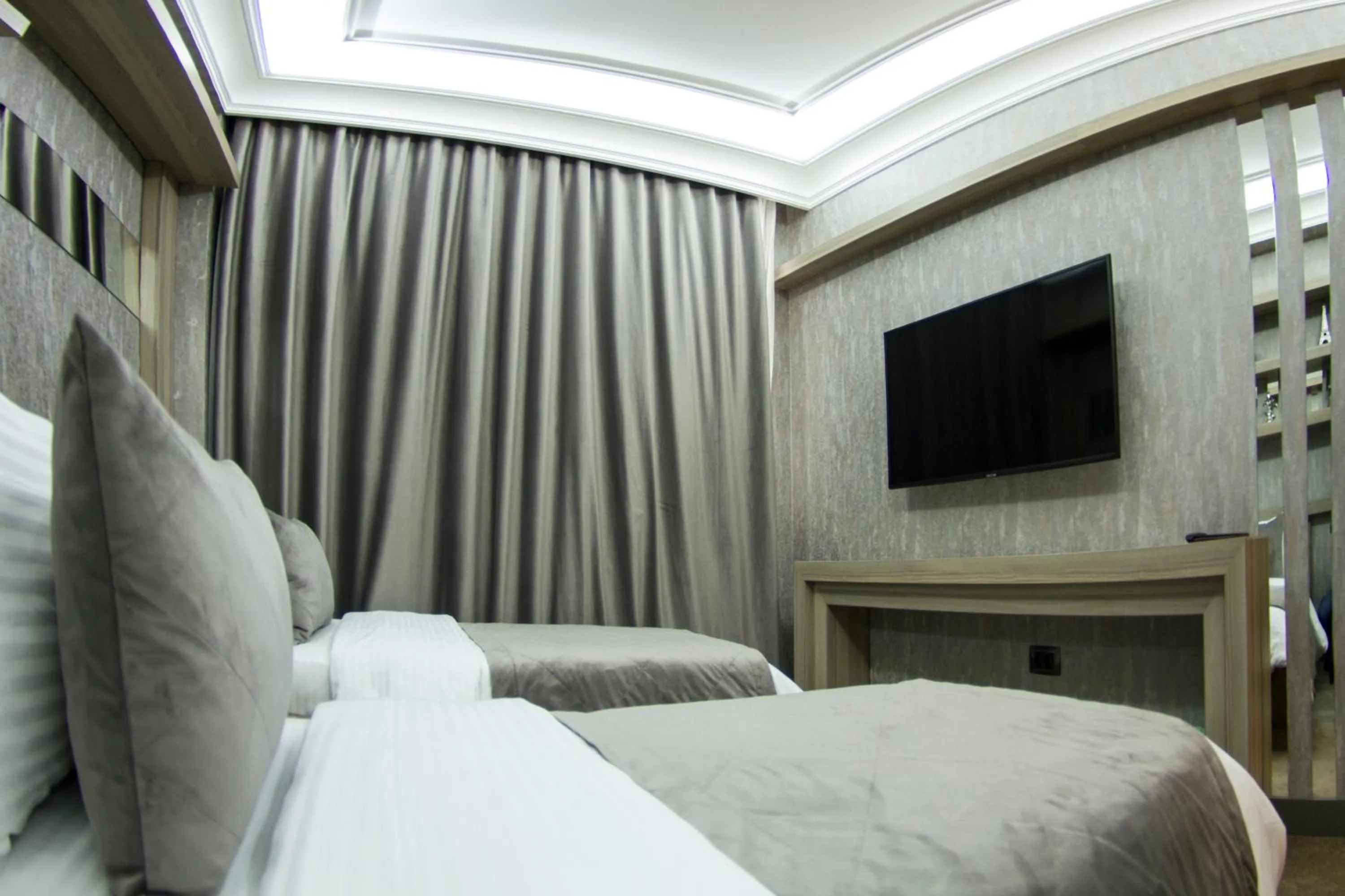 Bed in Home Boutique Hotel