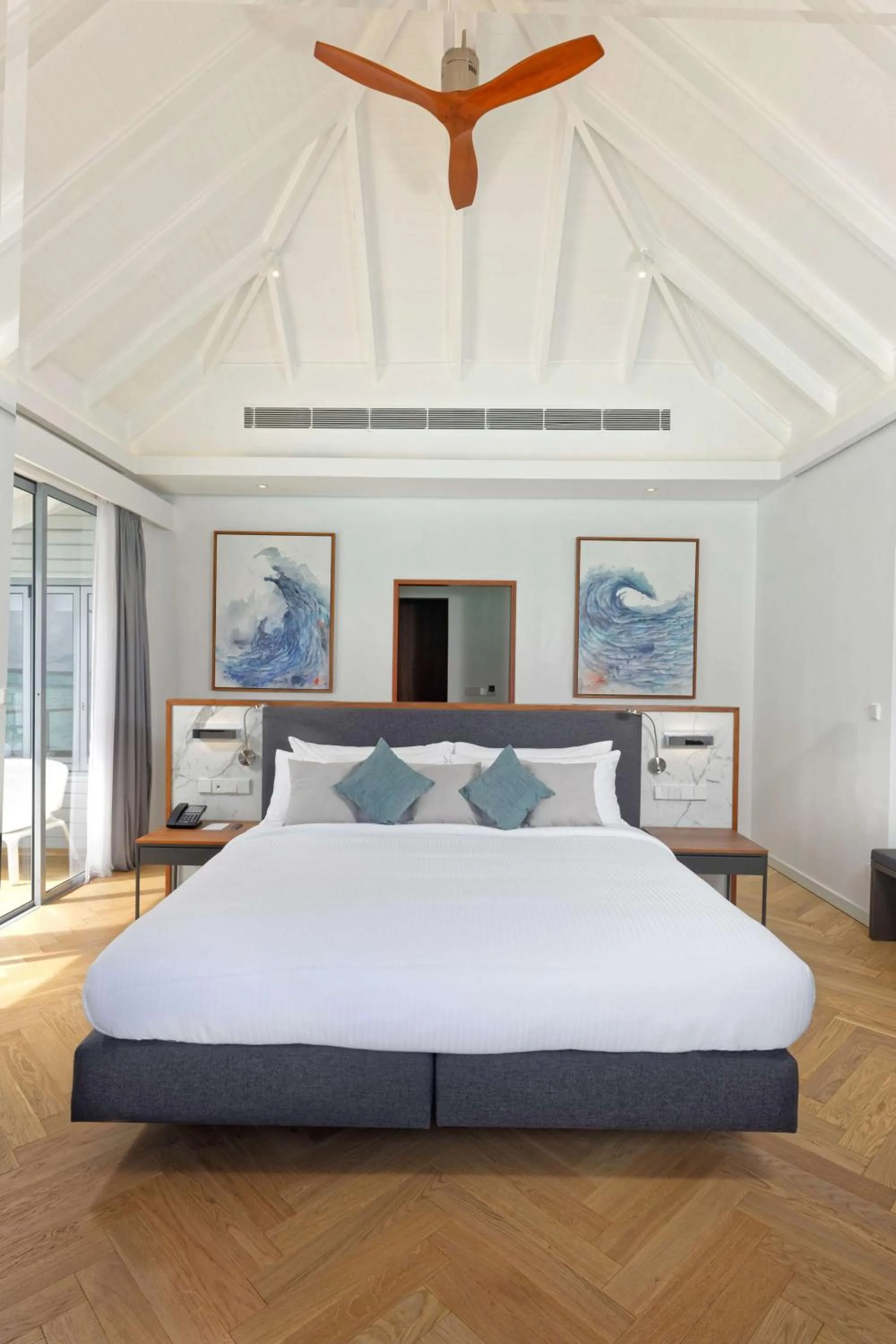 Photo of the whole room, Bed in OUTRIGGER Maldives Maafushivaru Resort