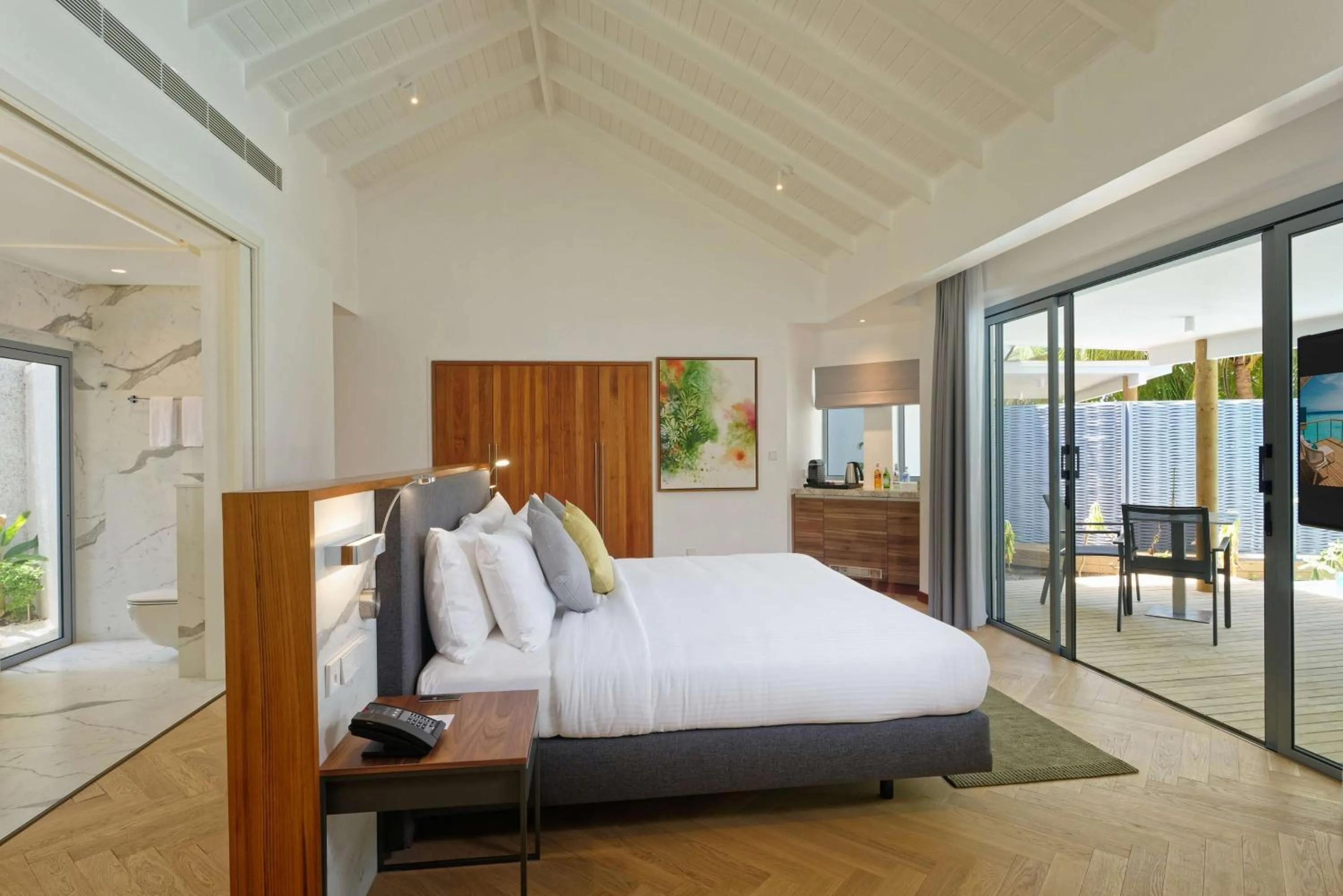 Photo of the whole room, Bed in OUTRIGGER Maldives Maafushivaru Resort