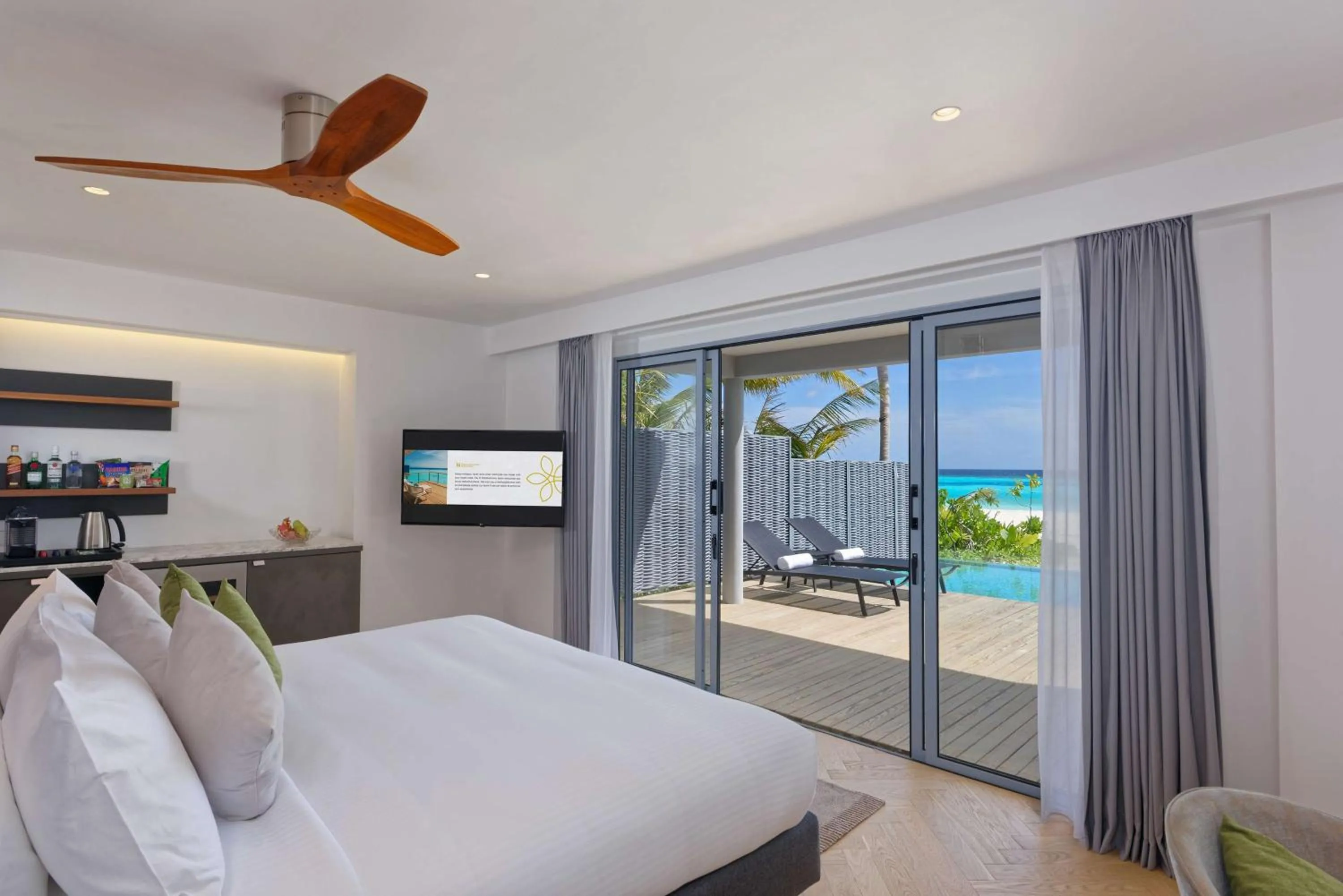 Photo of the whole room, Bed in OUTRIGGER Maldives Maafushivaru Resort