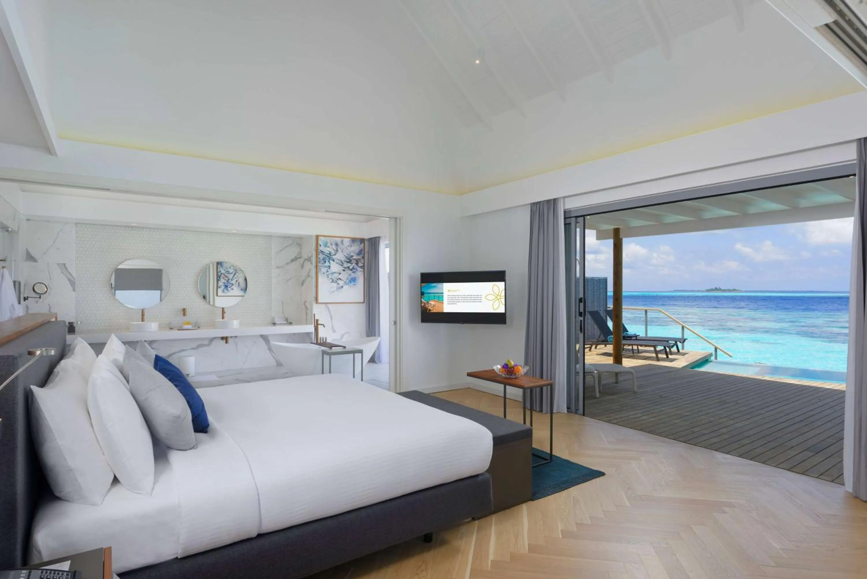 Photo of the whole room, Bed in OUTRIGGER Maldives Maafushivaru Resort