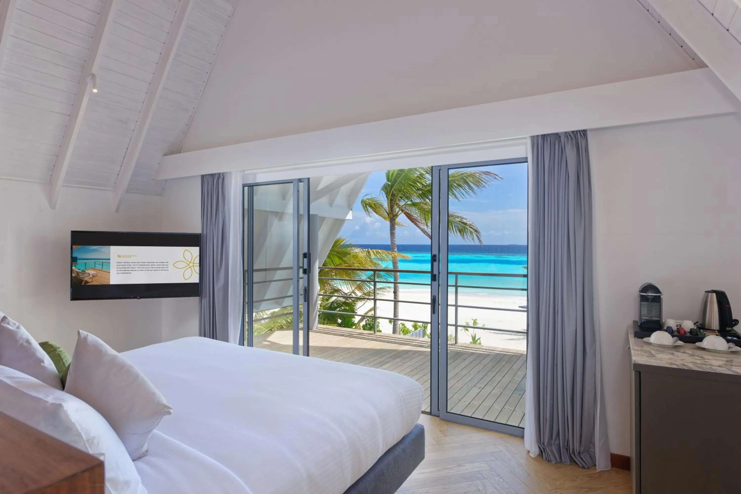 TV and multimedia, Bed in OUTRIGGER Maldives Maafushivaru Resort