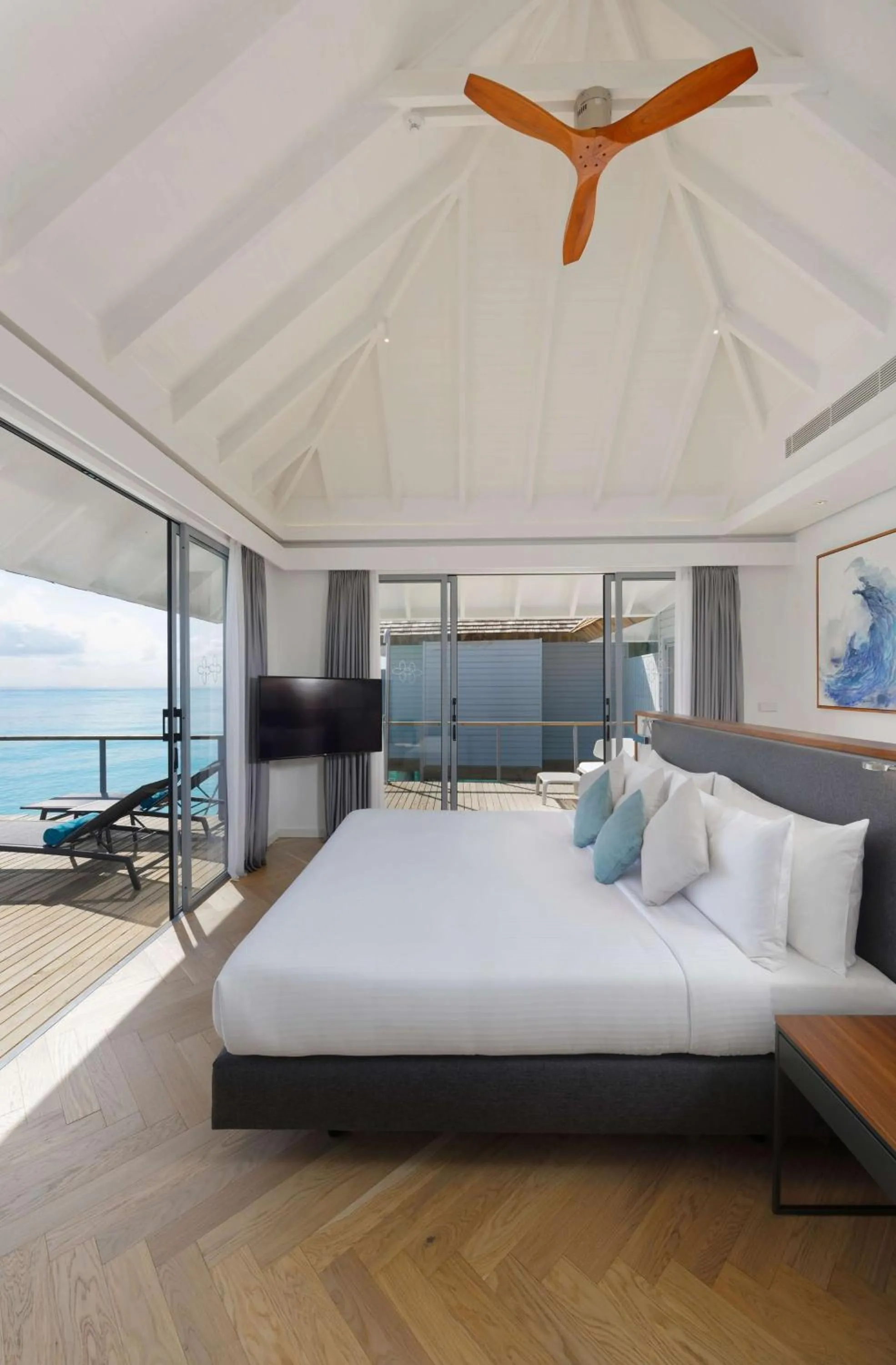 Photo of the whole room, Bed in OUTRIGGER Maldives Maafushivaru Resort