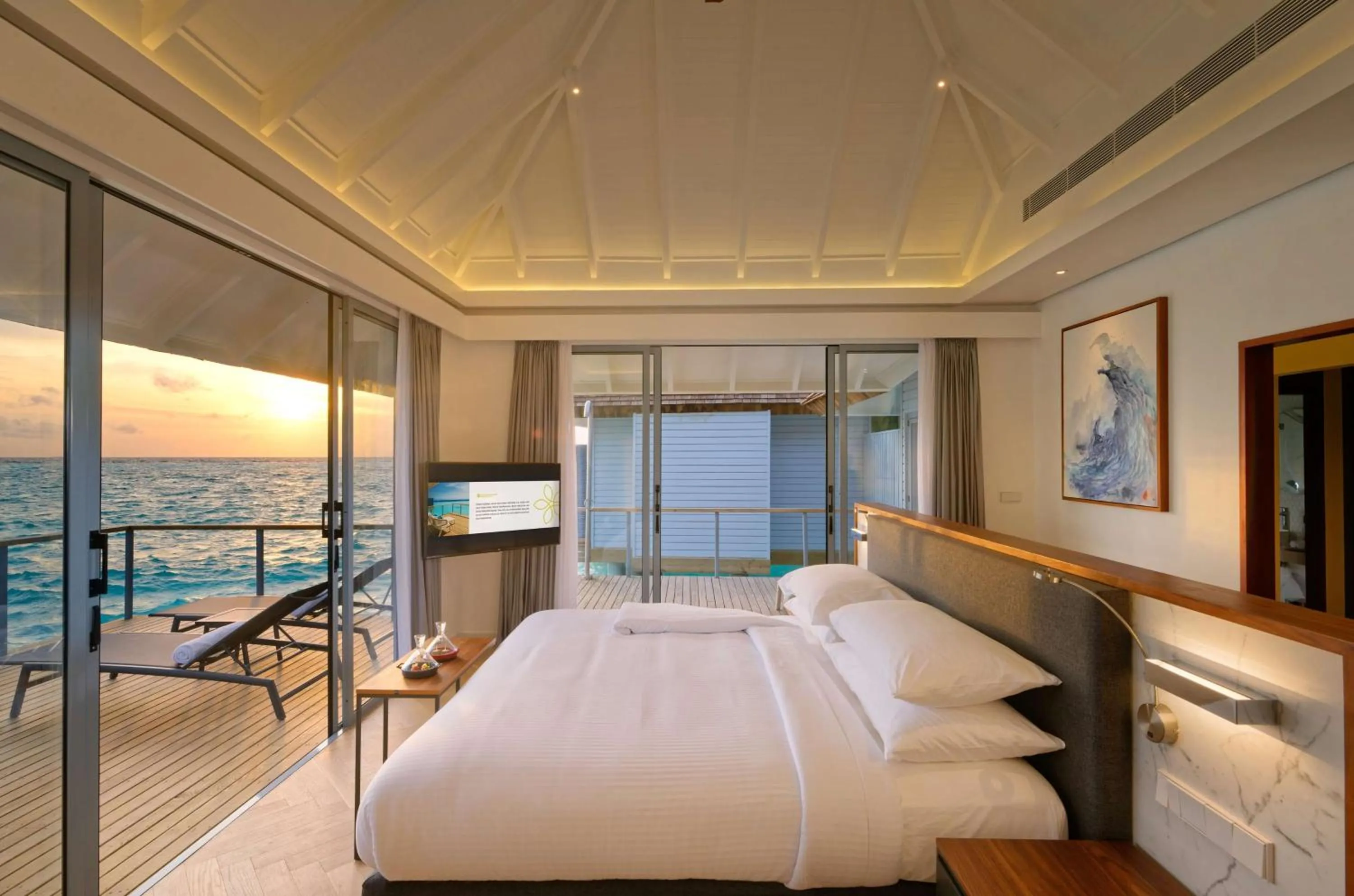 Photo of the whole room, Bed in OUTRIGGER Maldives Maafushivaru Resort