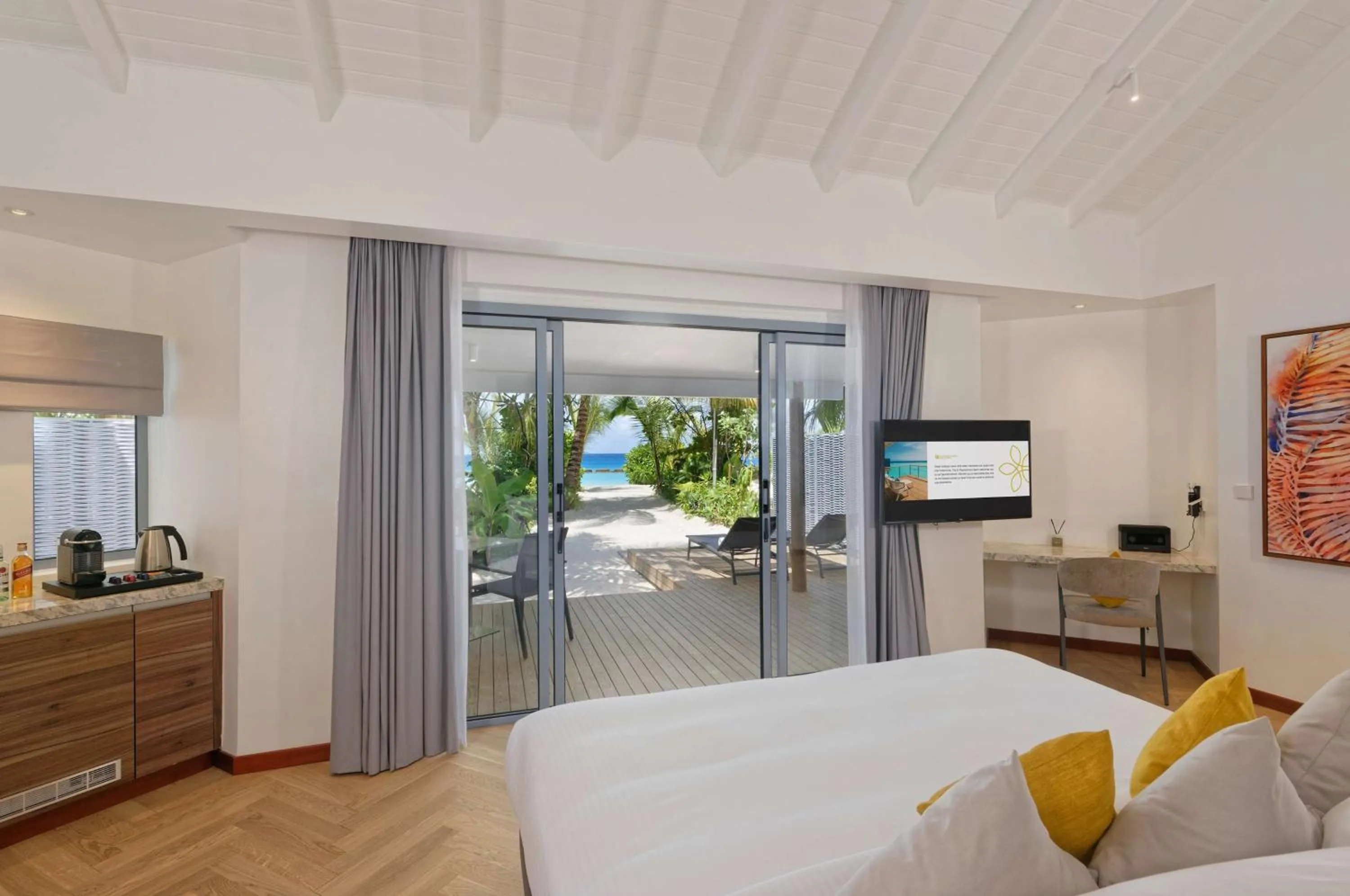 Photo of the whole room, Bed in OUTRIGGER Maldives Maafushivaru Resort