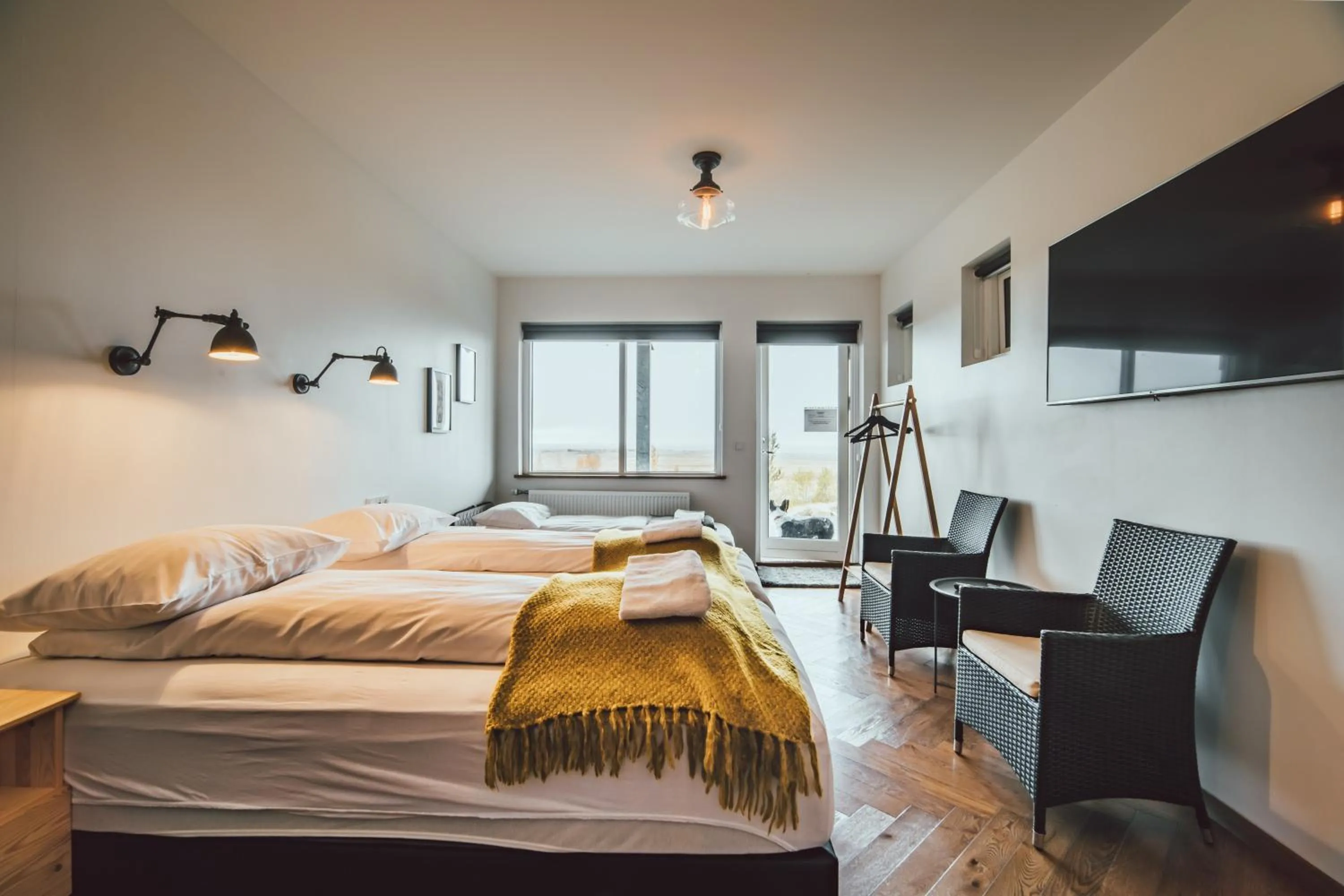 Communal lounge/ TV room, Bed in Ekra Glacier Lagoon