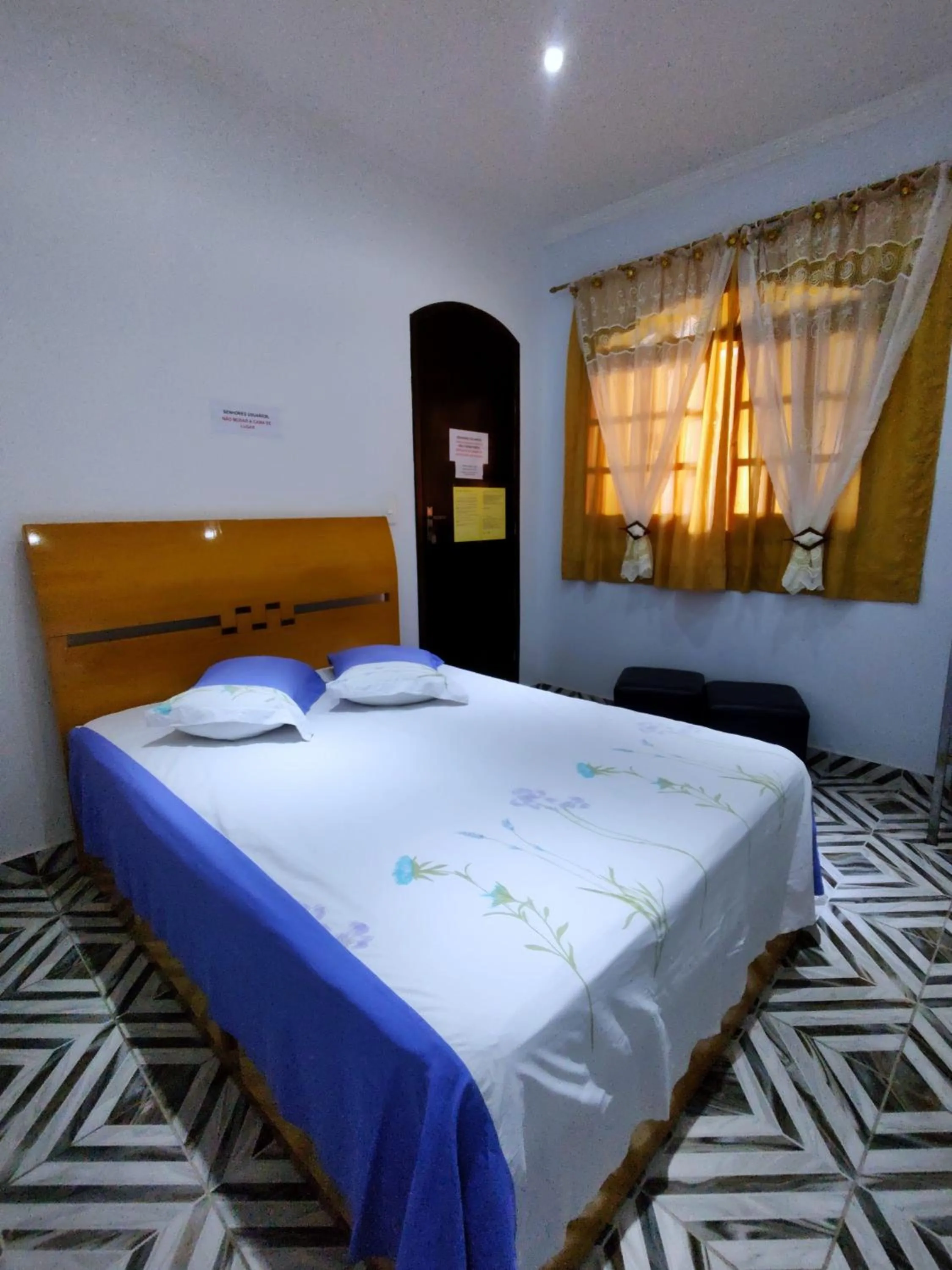 Bed in Pousada Guarulhos