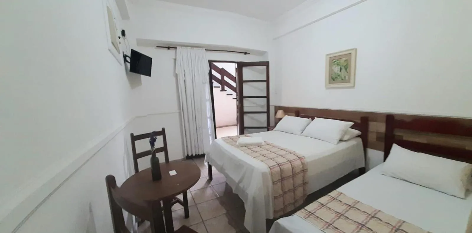 Bed in Pousada Mari