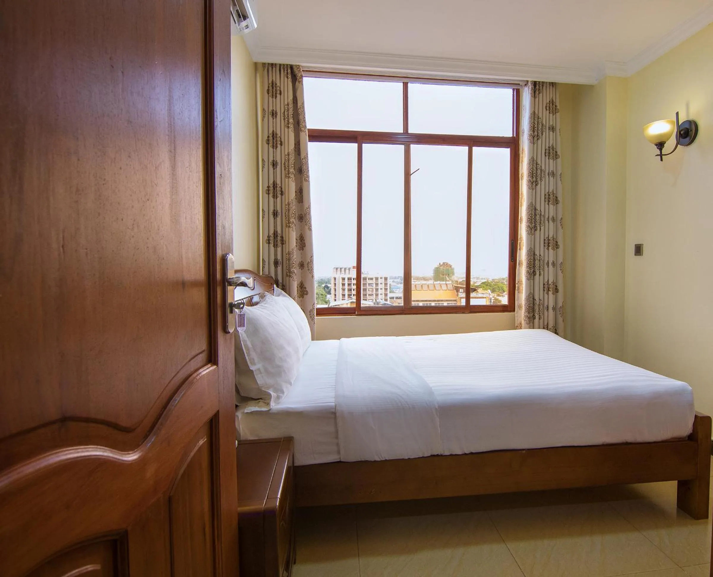 Bed in Kibo Palace Apartments