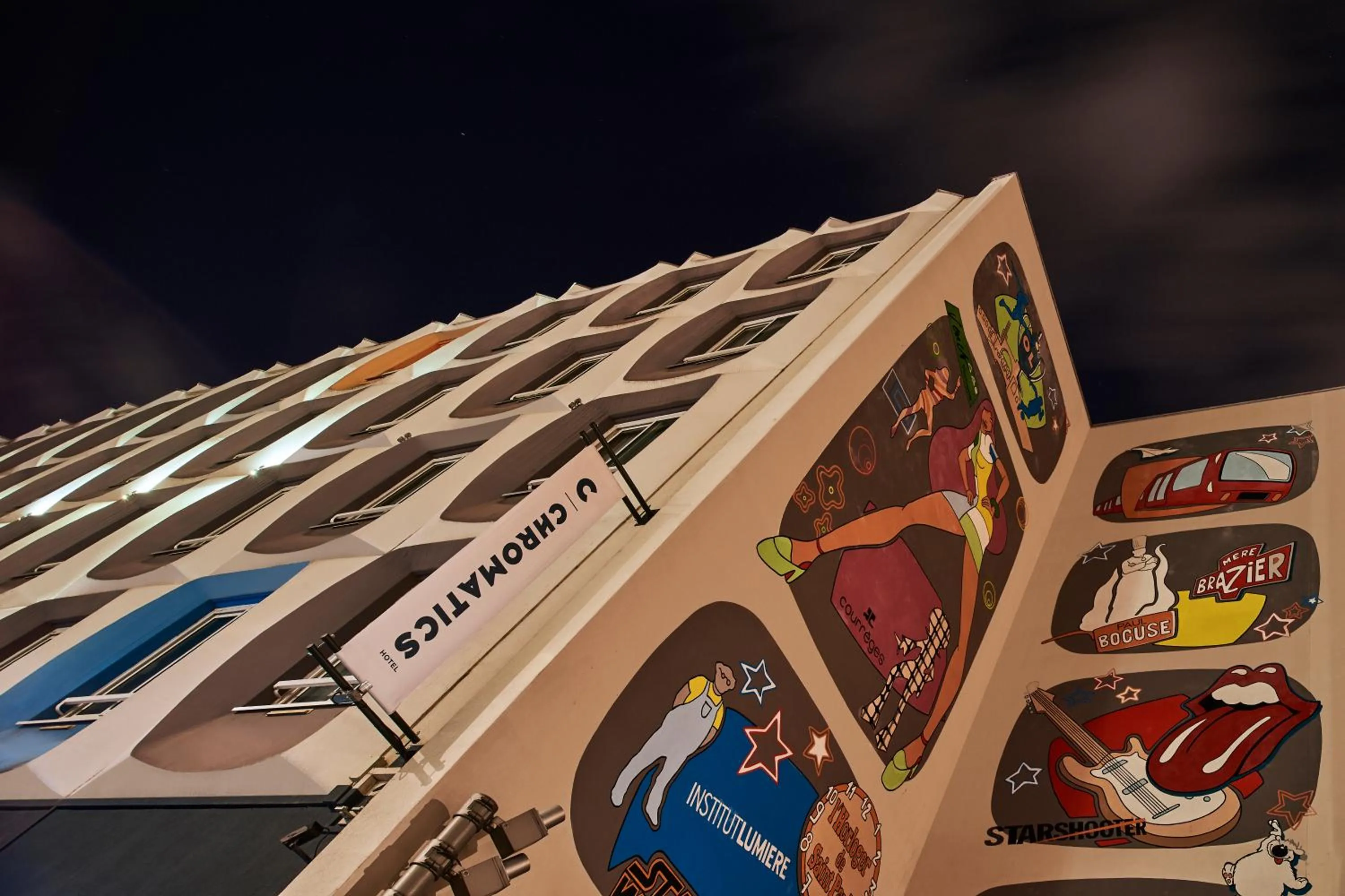 Property building in Hôtel Chromatics & Restaurant Hill Club by HappyCulture