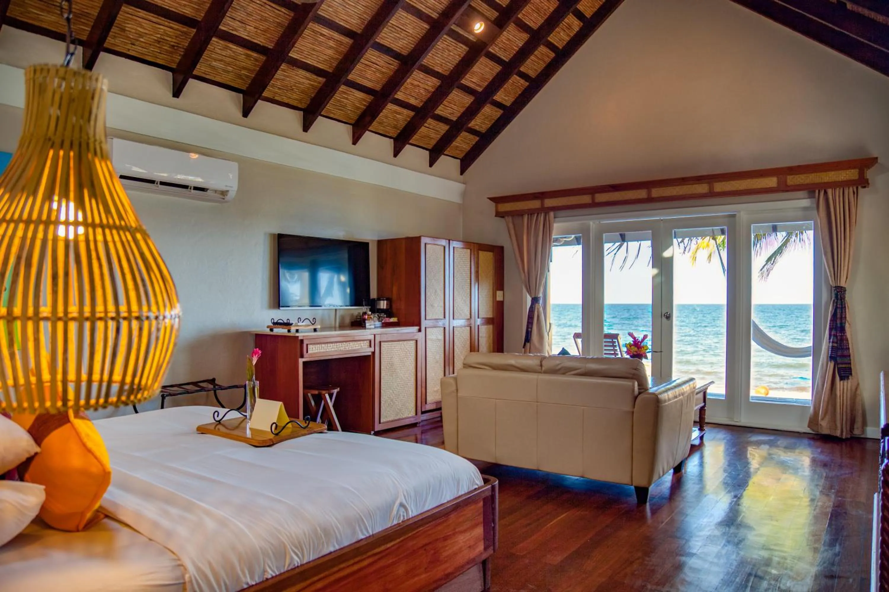 Bed in Almond Beach Resort at Jaguar Reef