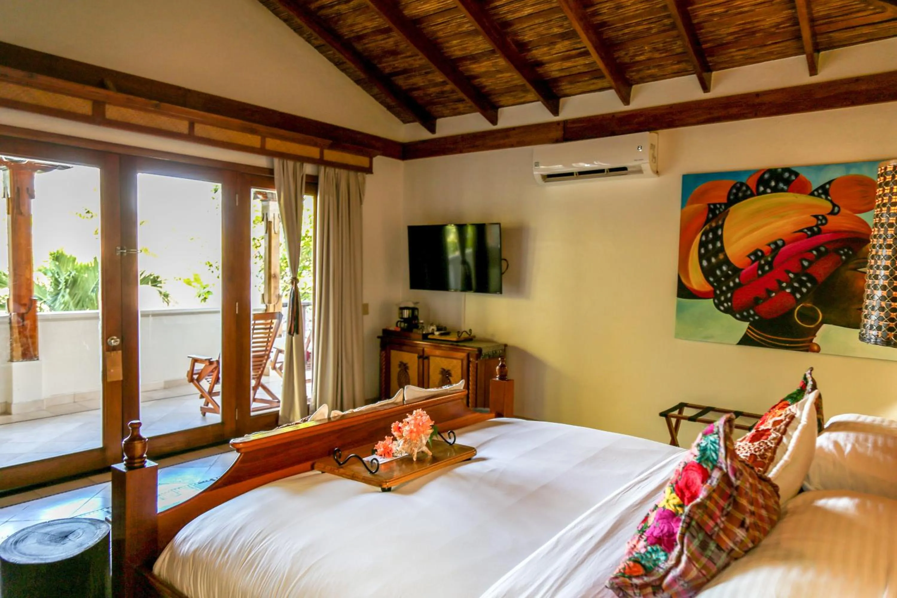 Bed in Almond Beach Resort at Jaguar Reef