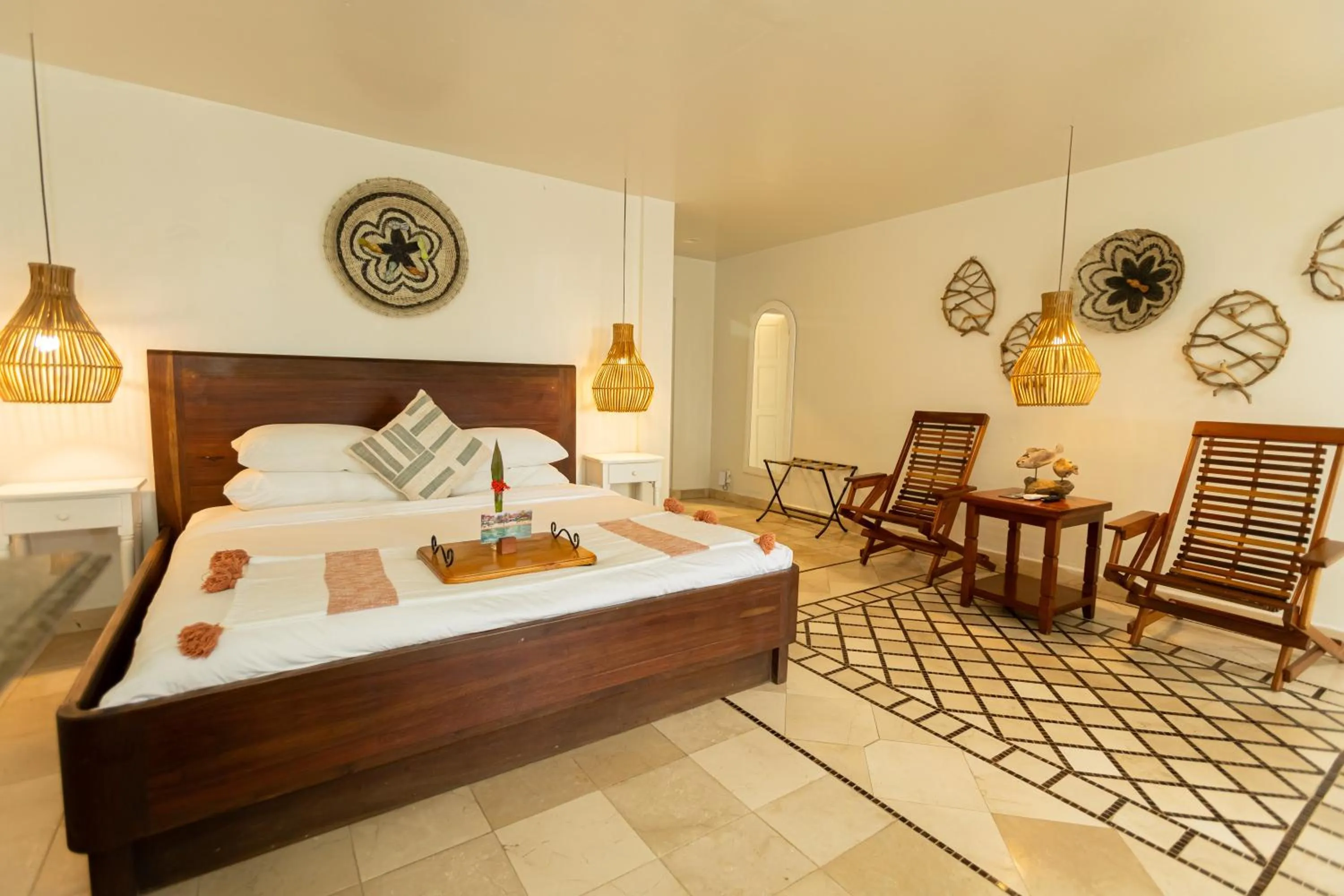 Bed in Almond Beach Resort at Jaguar Reef