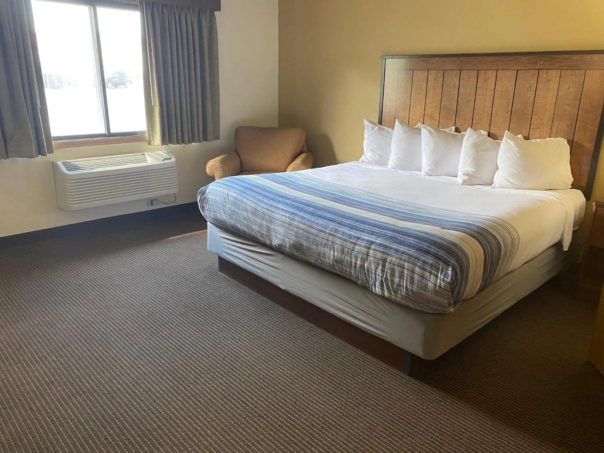 Bed in AmericInn by Wyndham Two Harbors Near Lake Superior